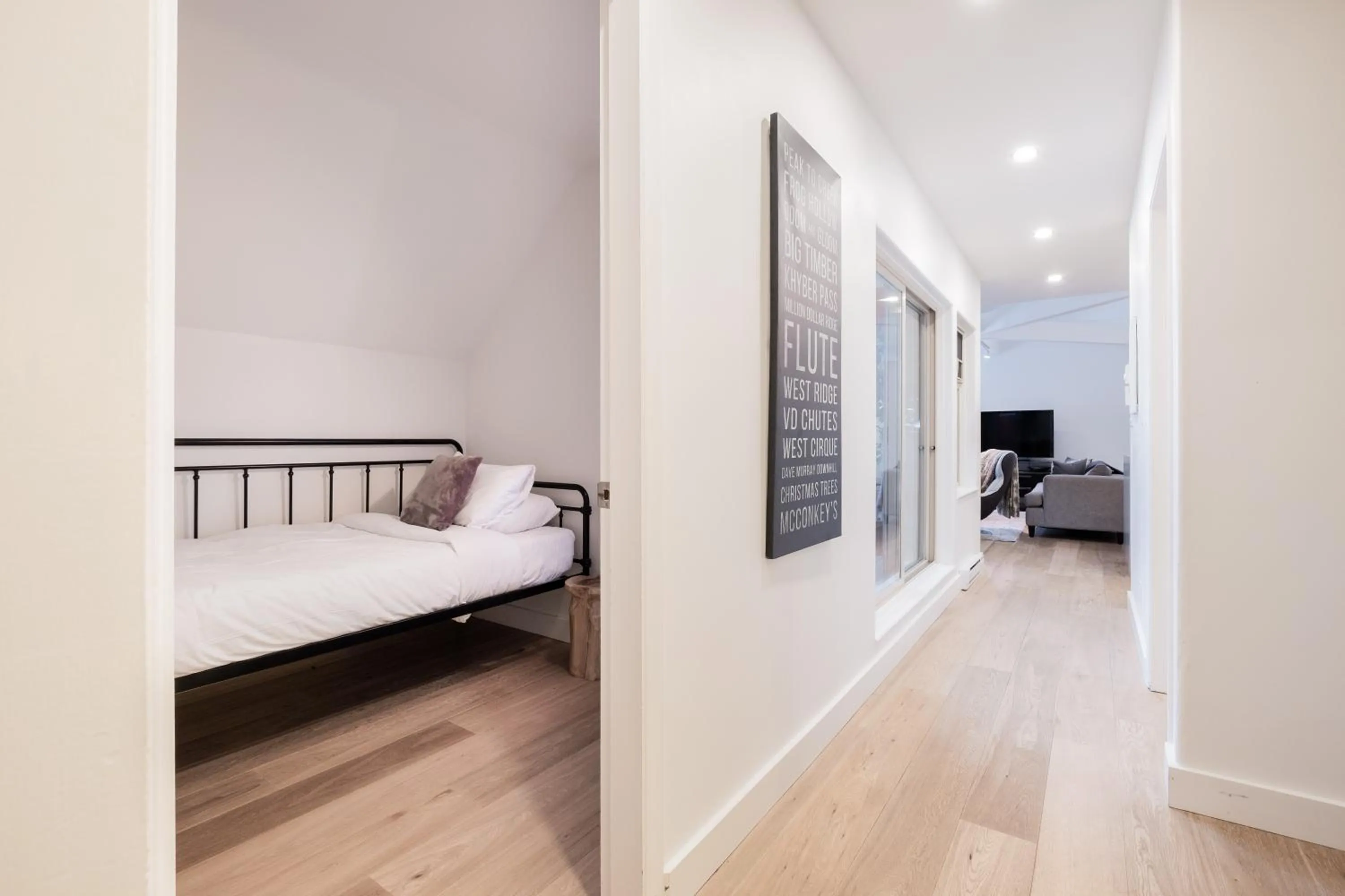 Bed in Lake Placid Lodge by Outpost Whistler