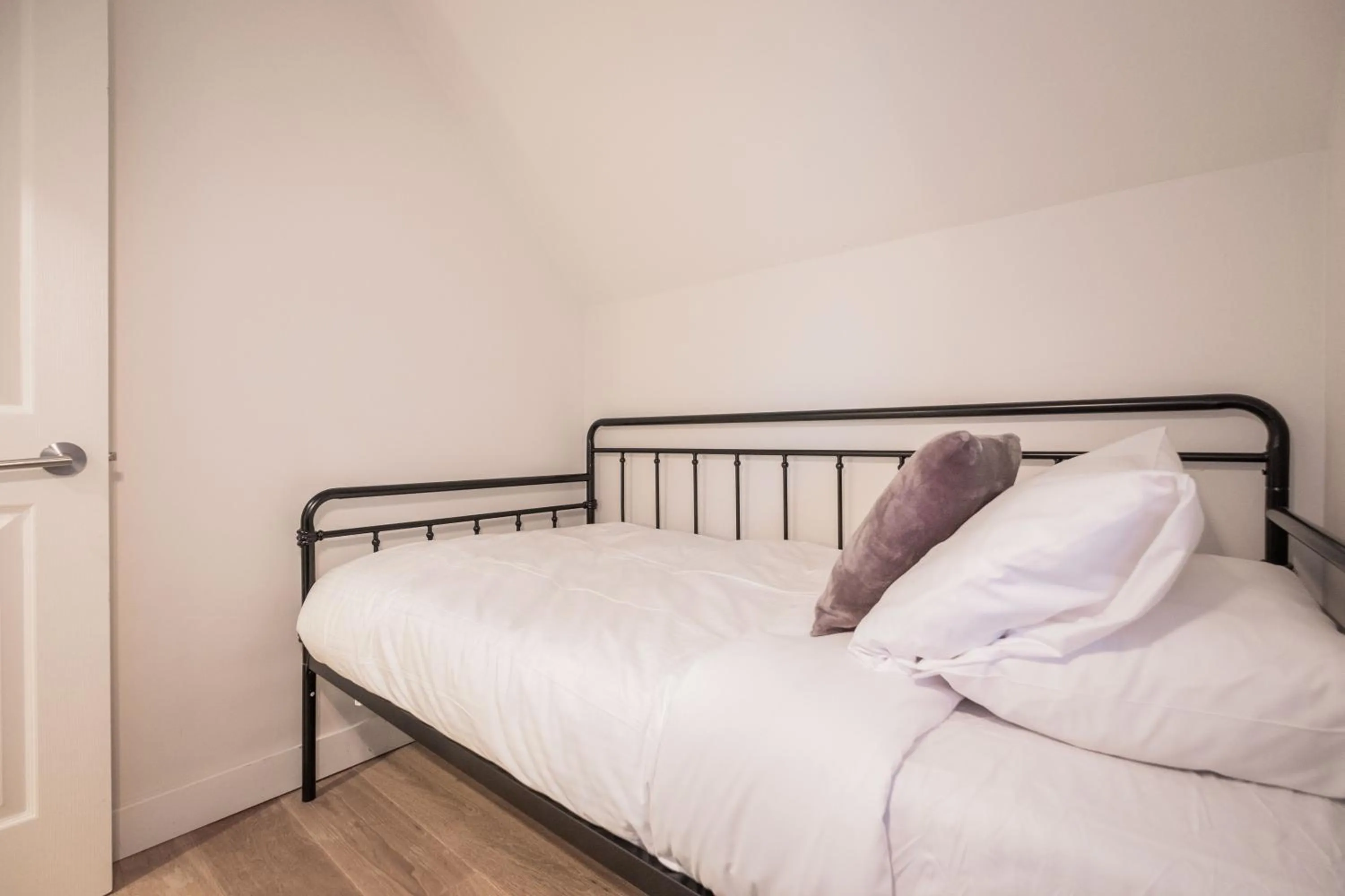 Bed in Lake Placid Lodge by Outpost Whistler