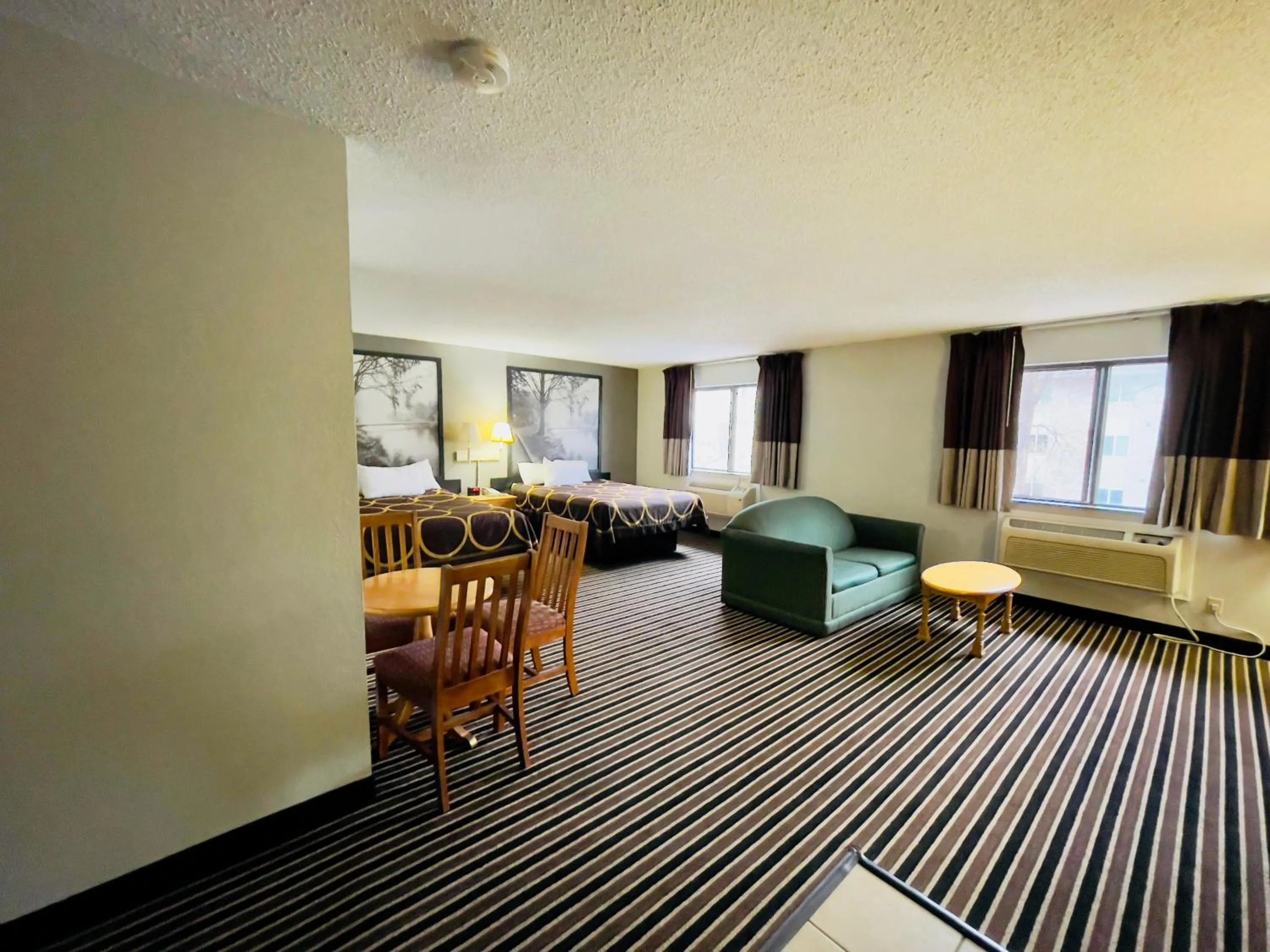 Seating area in Super 8 by Wyndham Shakopee