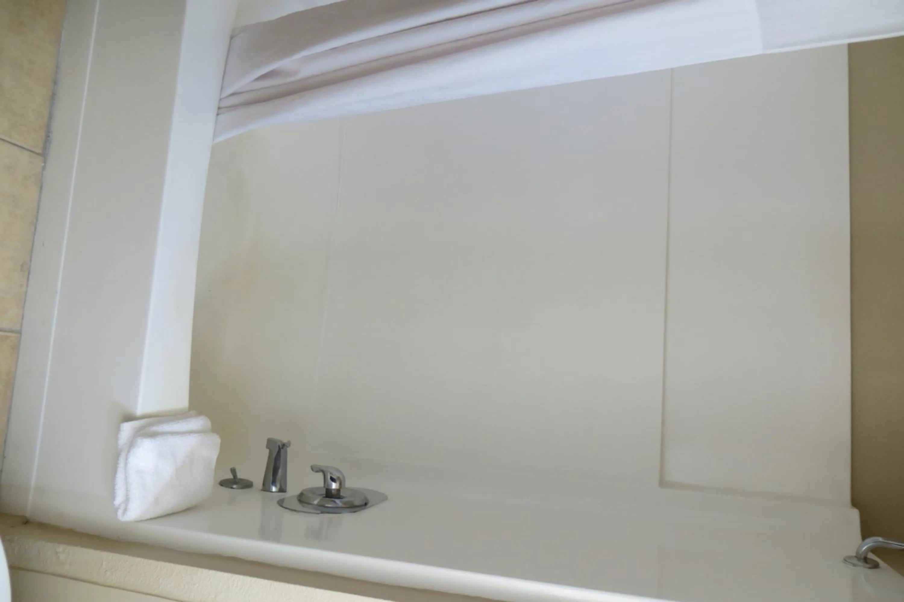 Bathroom in American Inn Stockton