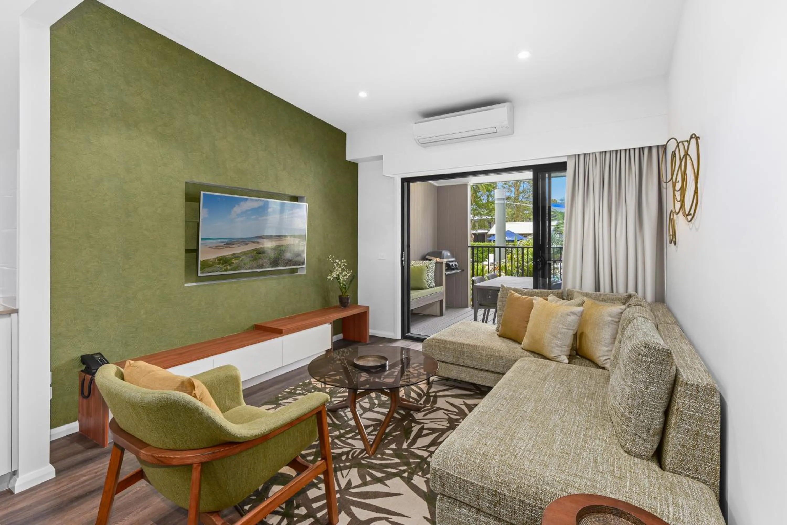 Living room in Club Wyndham Flynns Beach, Trademark Collection by Wyndham