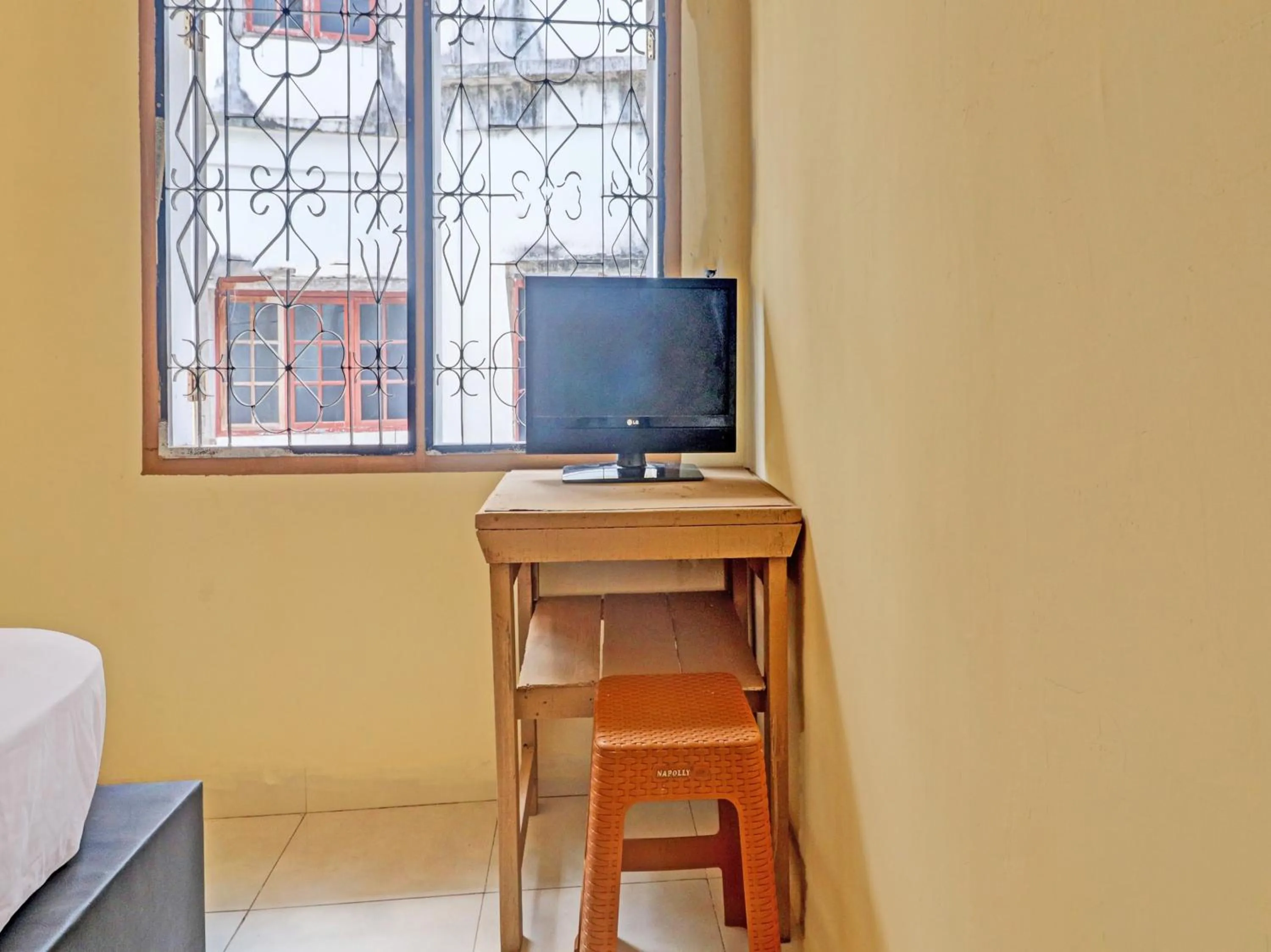 Bedroom in Hotel O Excellent Kost