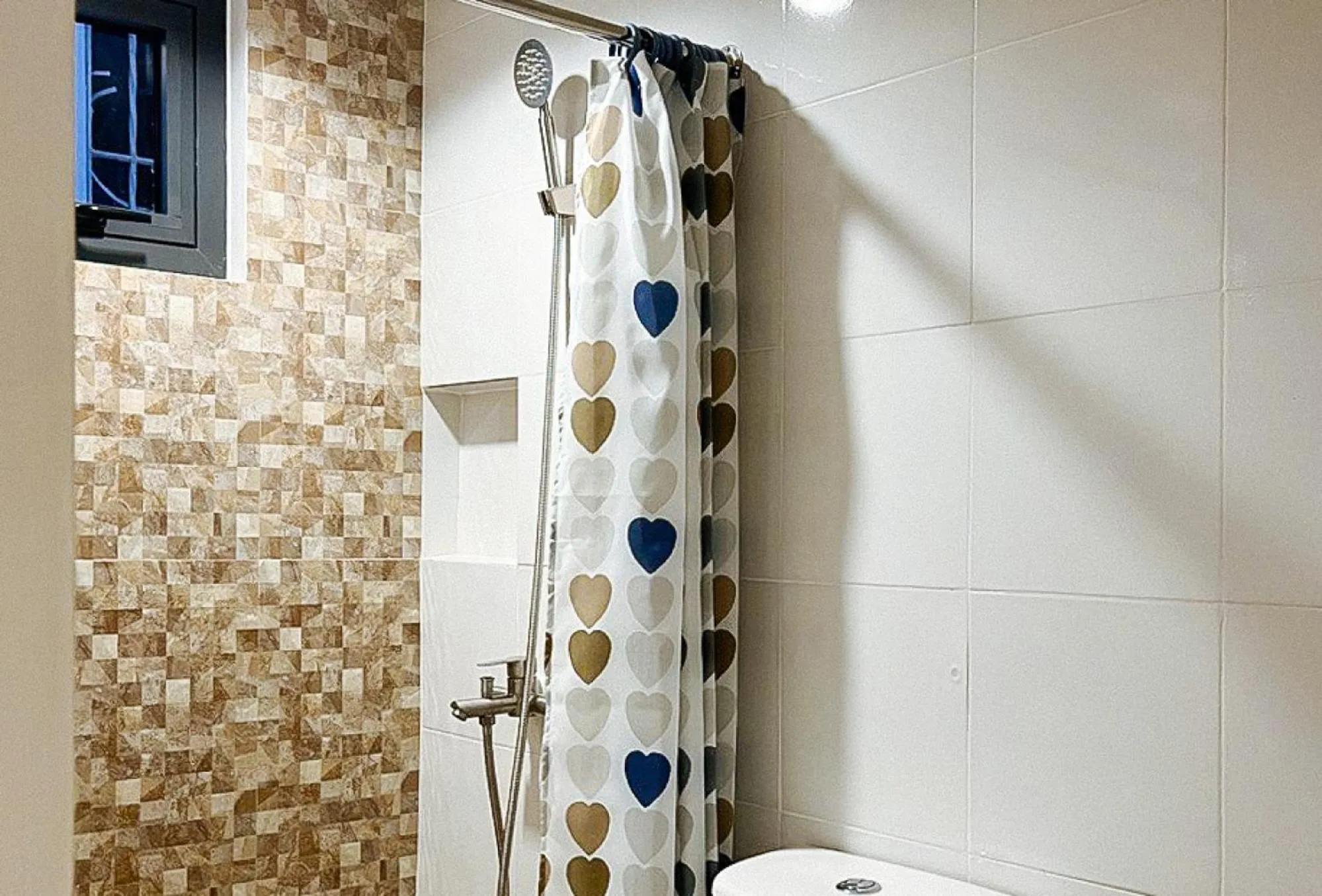 Shower in Lea Robert Hotel Angeles Pampanga by RedDoorz