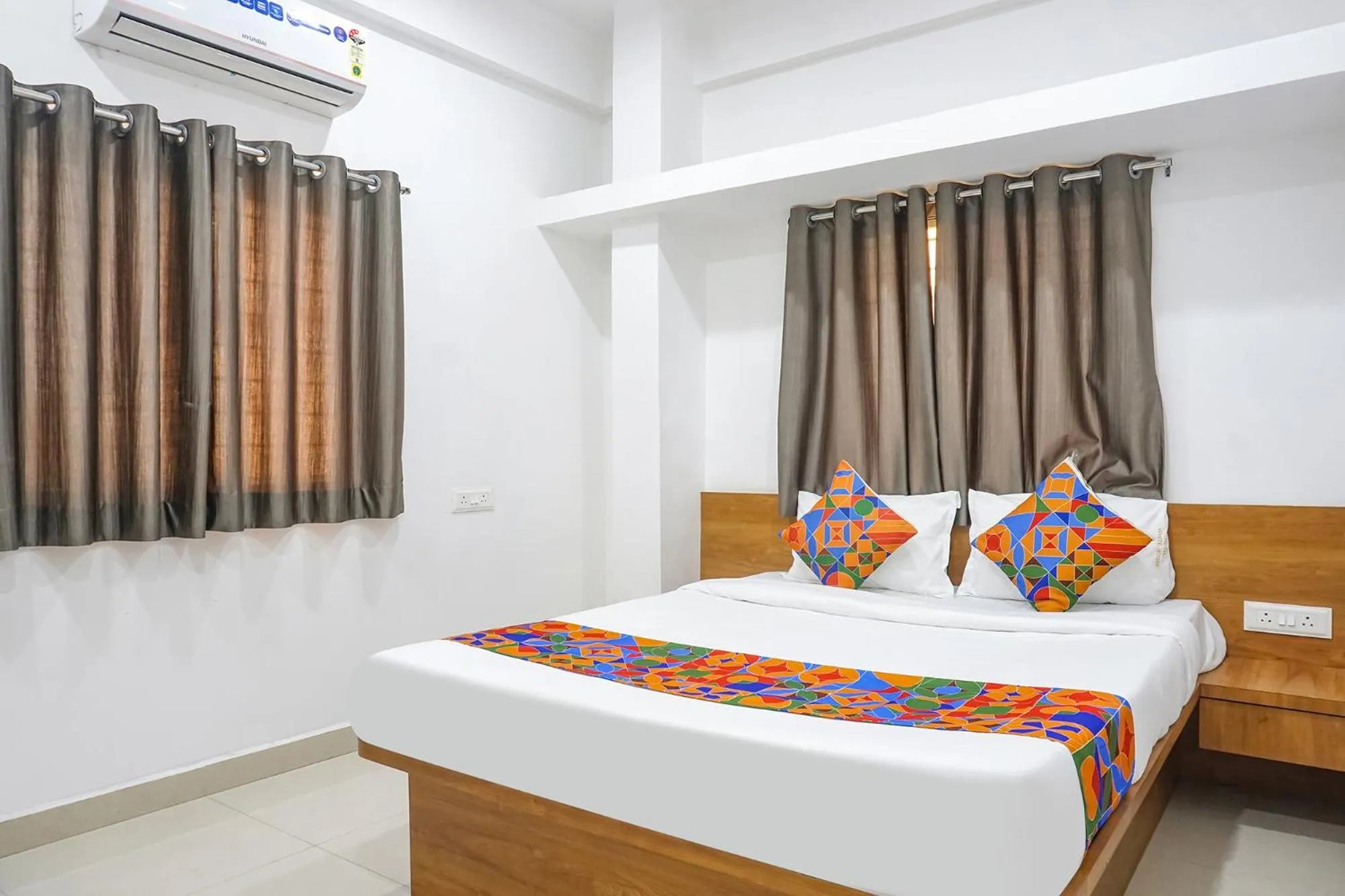 Bed in FabHotel The White House Inn