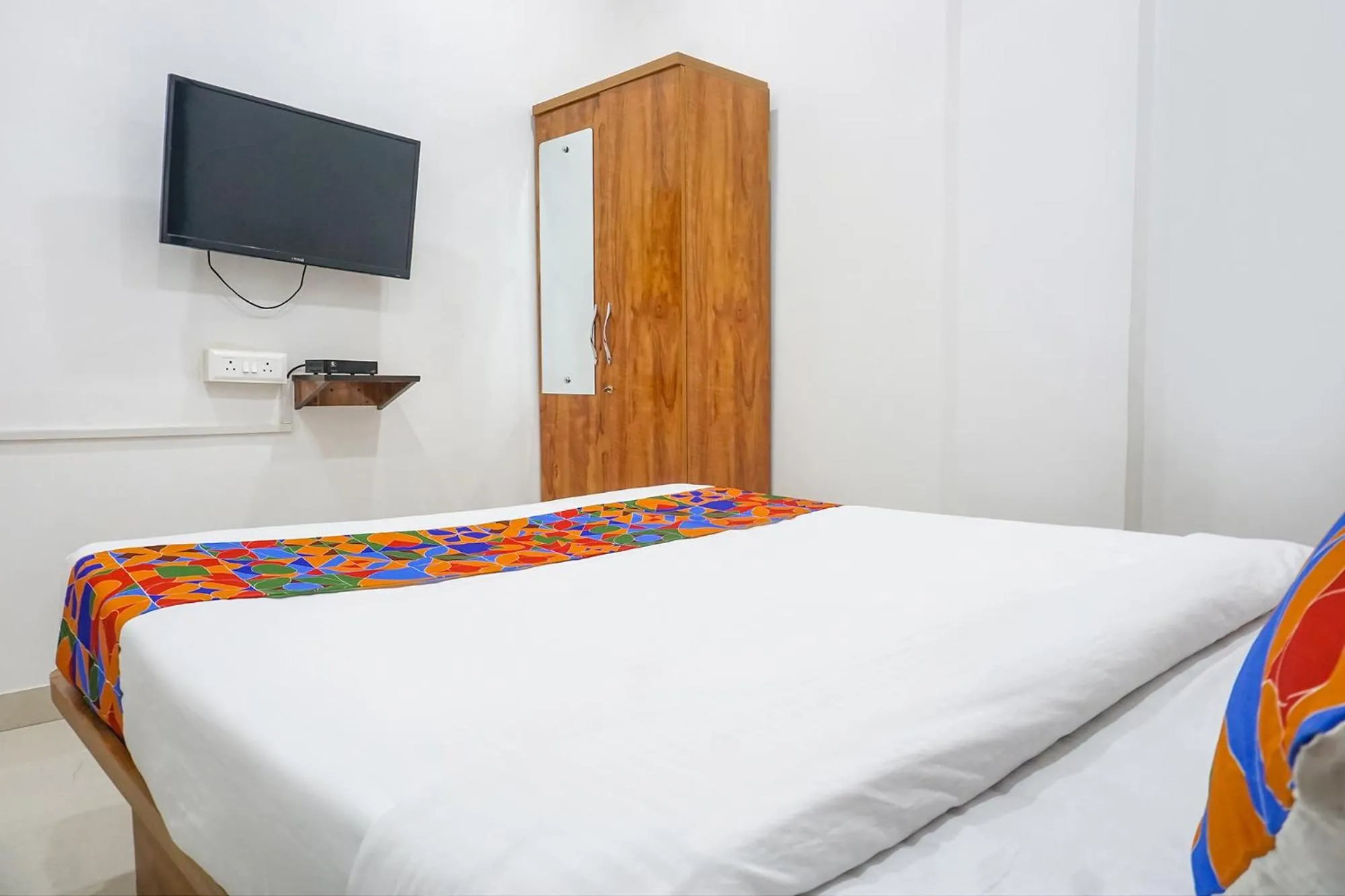 Bed in FabHotel The White House Inn