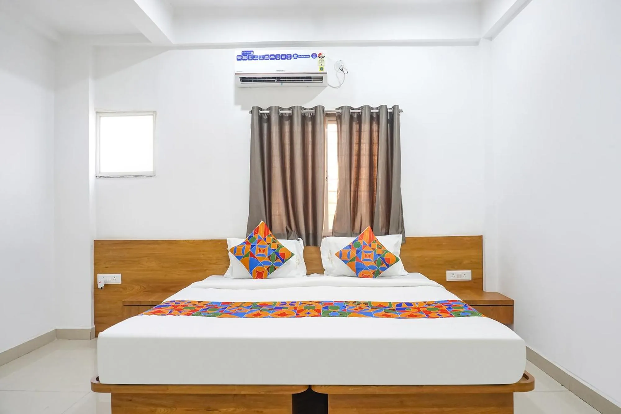 Bed in FabHotel The White House Inn