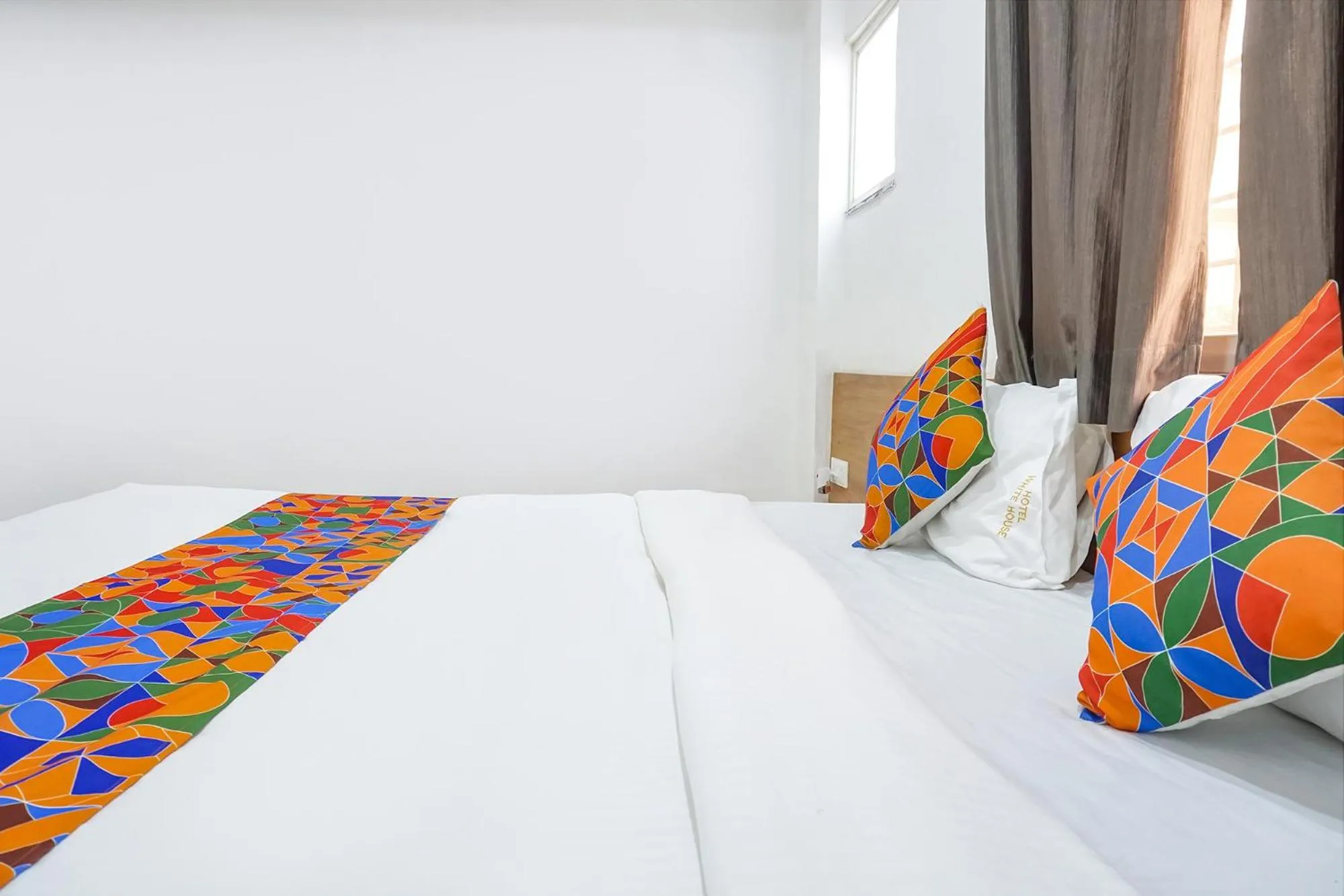 Bed in FabHotel The White House Inn