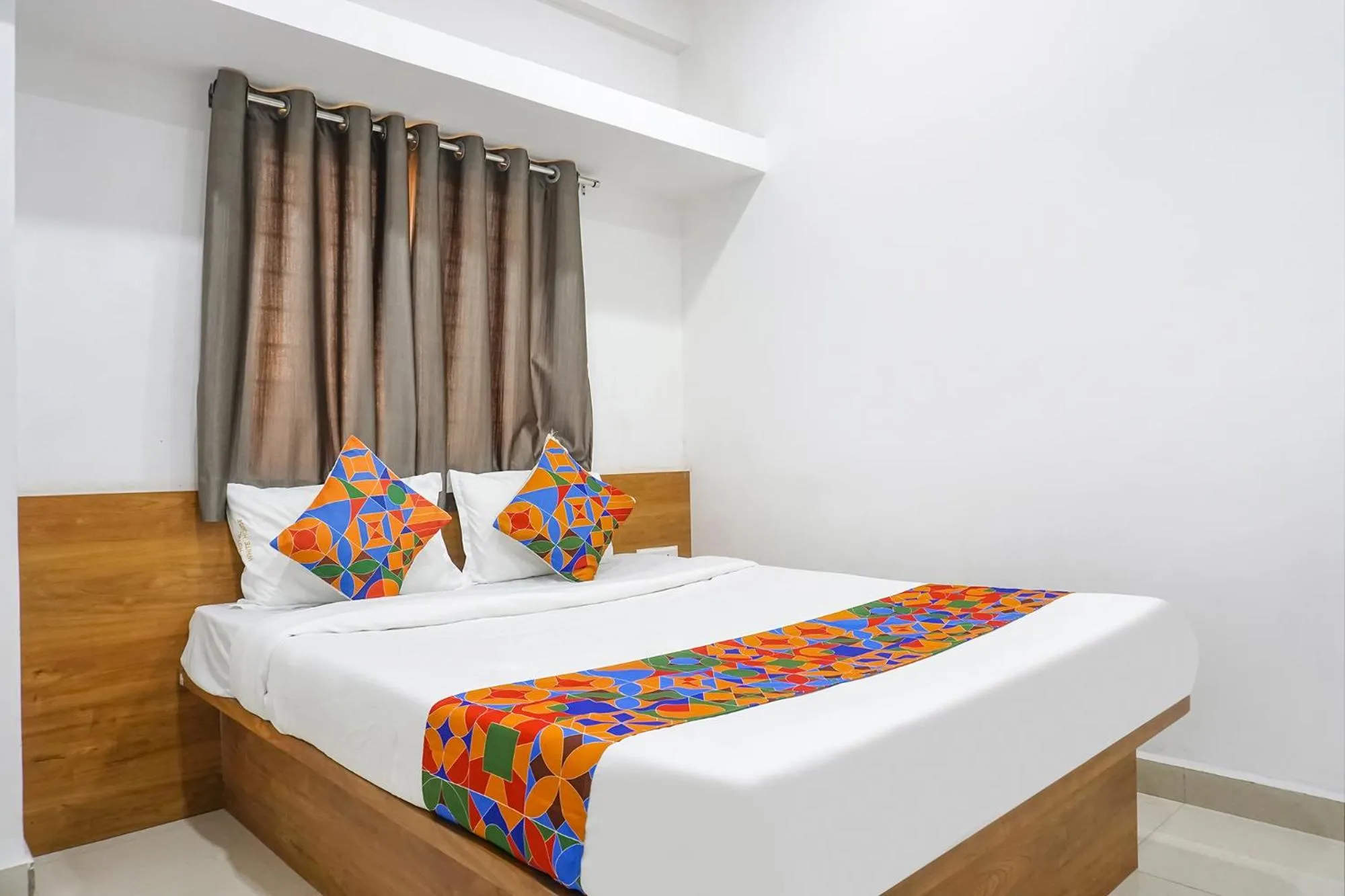 Bed in FabHotel The White House Inn