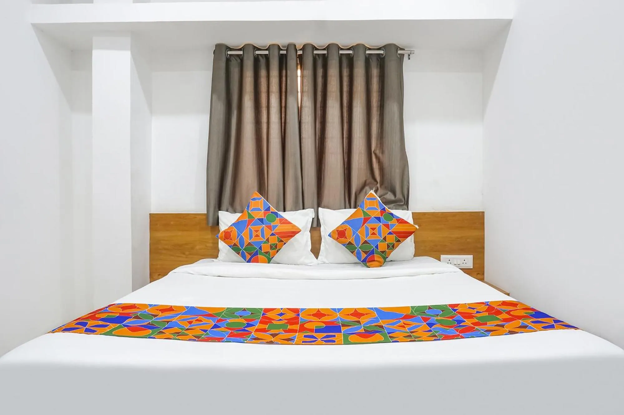 Bed in FabHotel The White House Inn