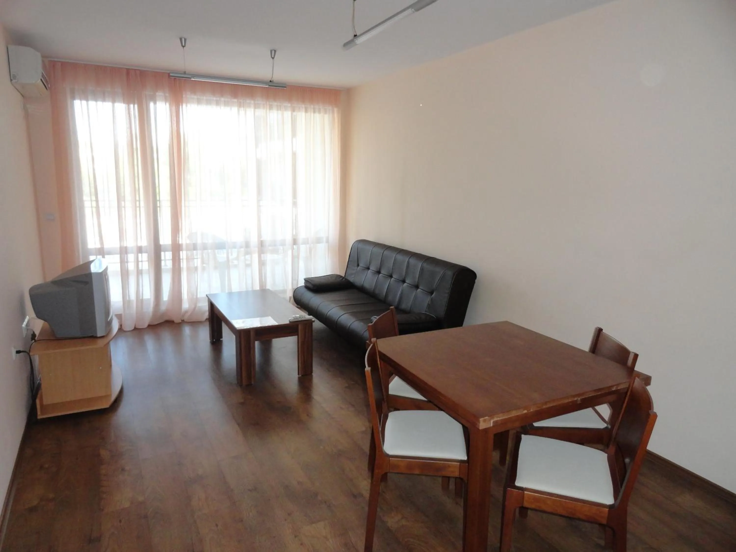 Living room in Cantilena Complex