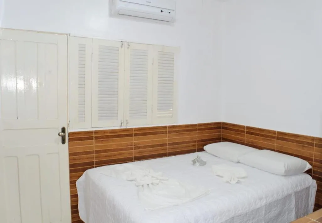 Bed in Pousada Recanto do Amanhecer