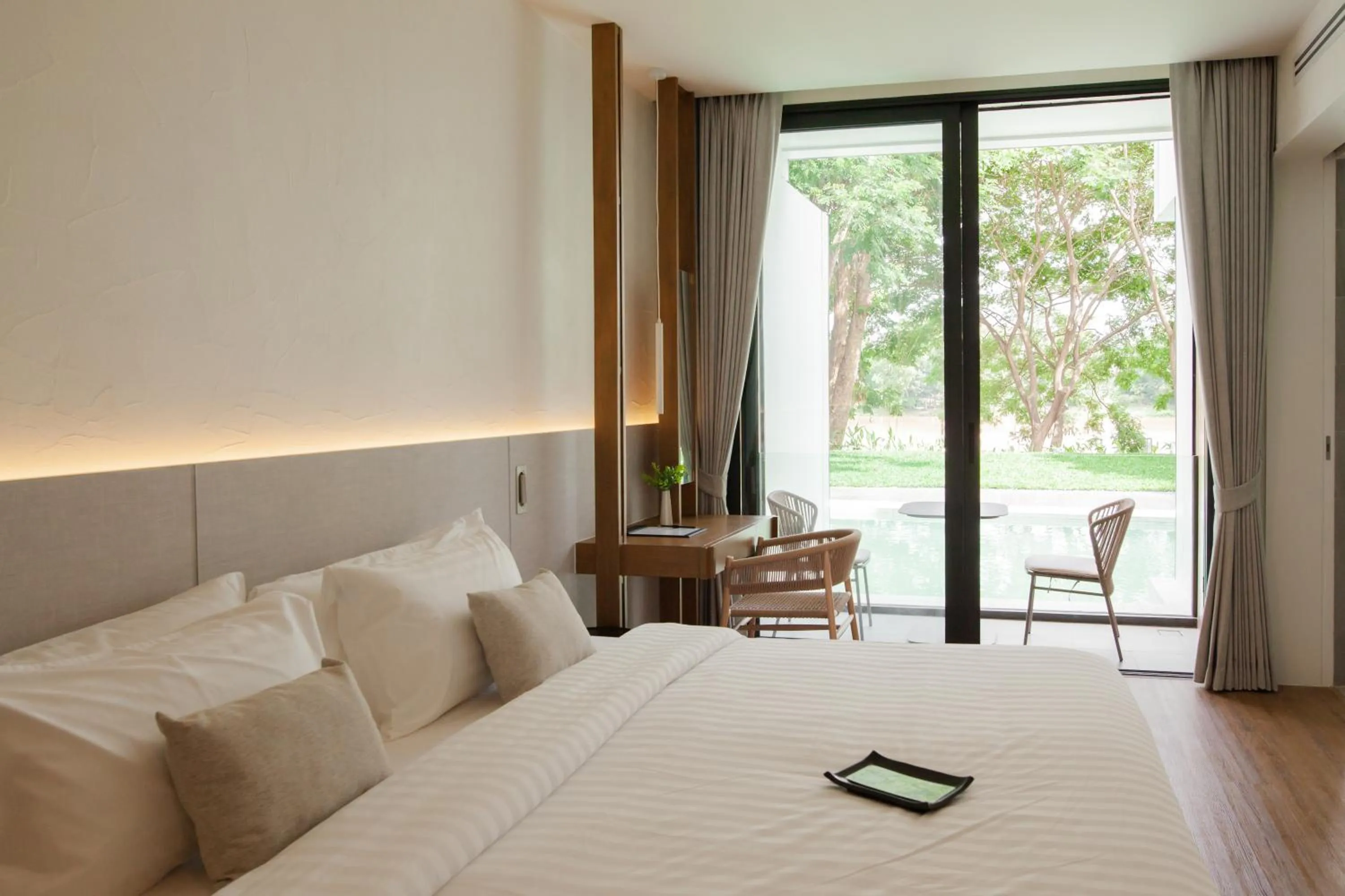 Seating area, Bed in Riva Vista Riverfront Resort Chiang Rai