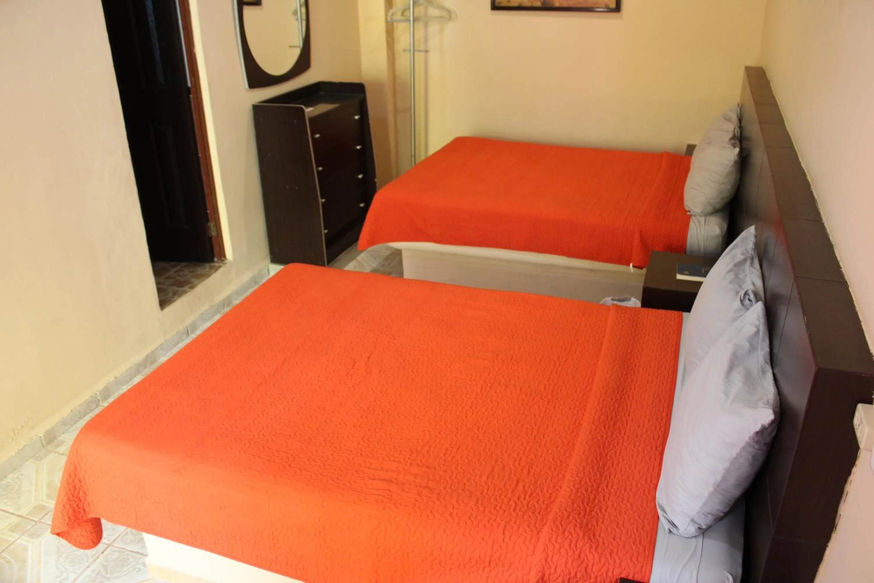 Bed in Hotel Guaranducha Inn