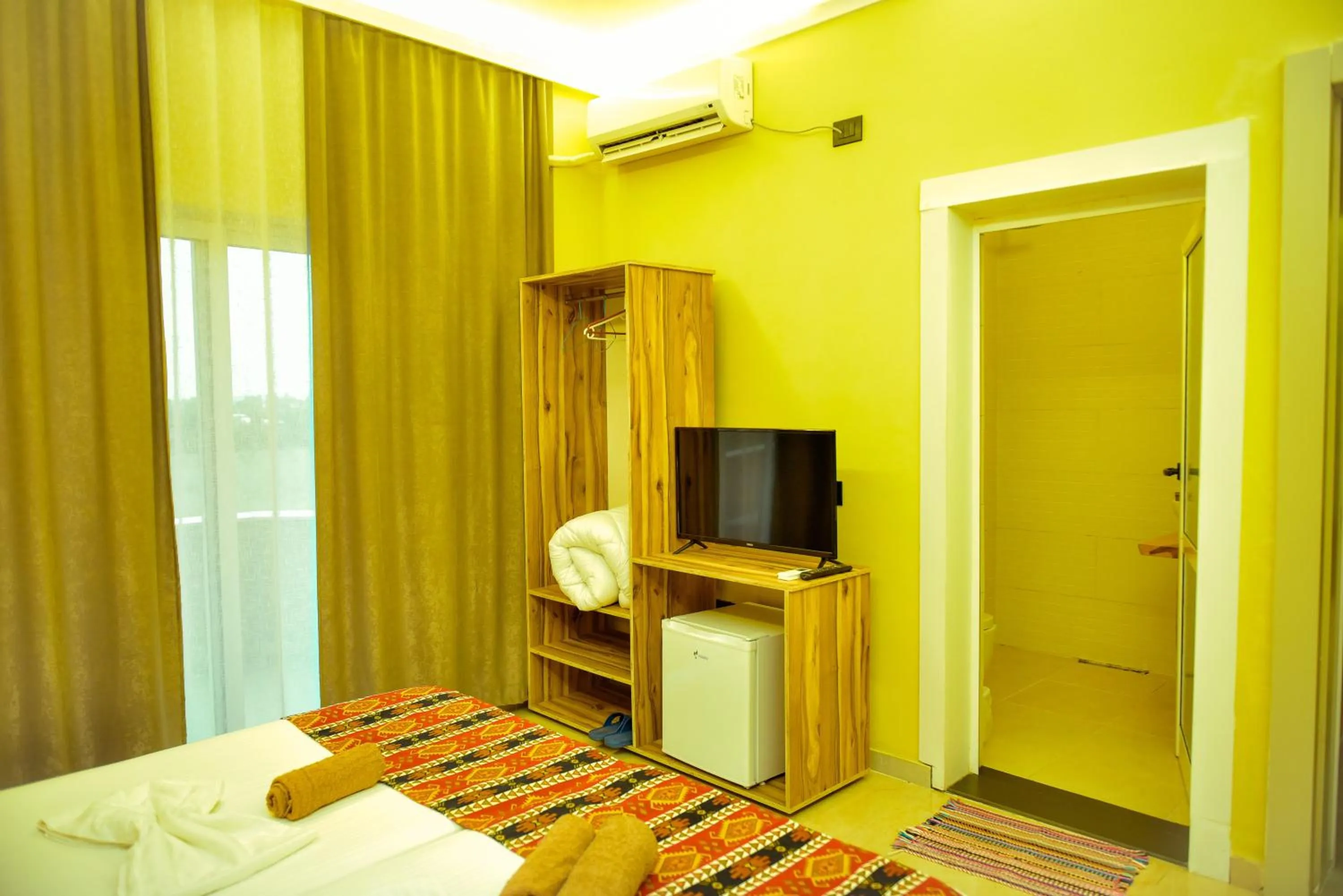 TV and multimedia, Bed in TE BUJTINA HOTEL- Cozy Stay with Traditional Breakfast Near Beach