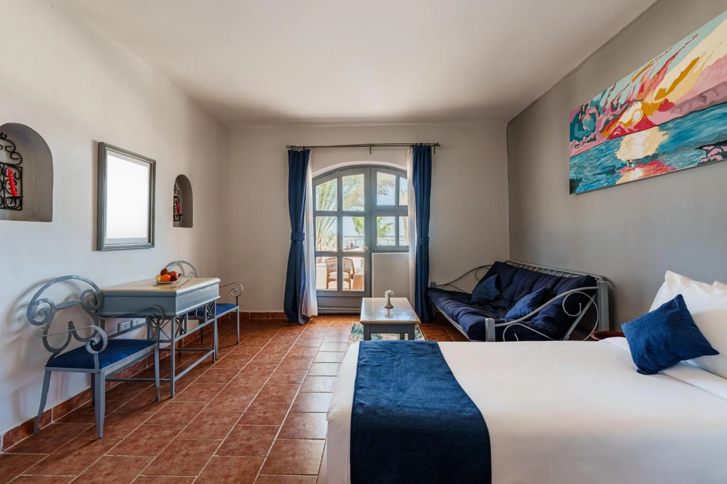 Seating area, Bed in Protels Crystal Beach Resort