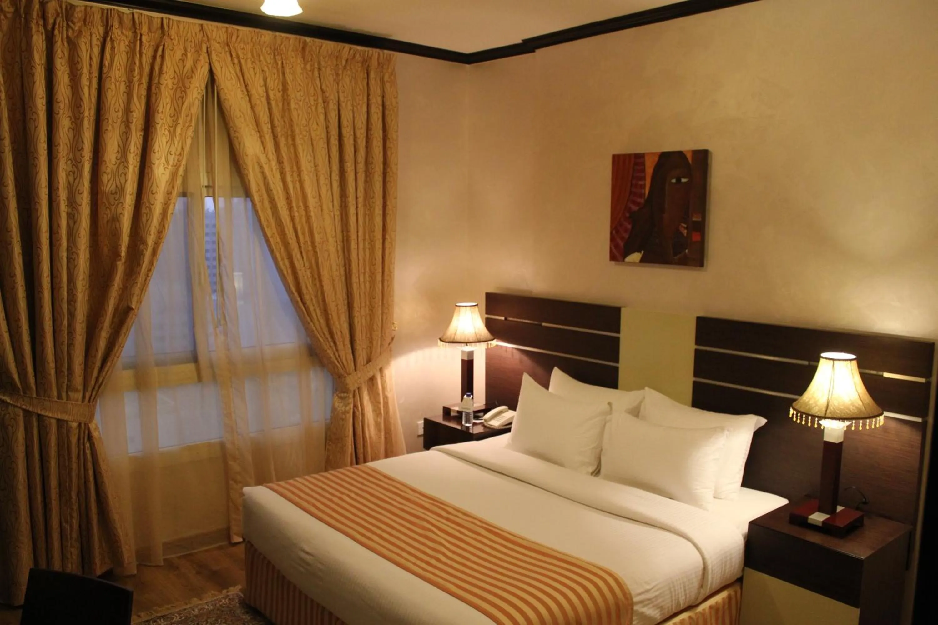 Bed in Boulevard City Suites Hotel Apartments