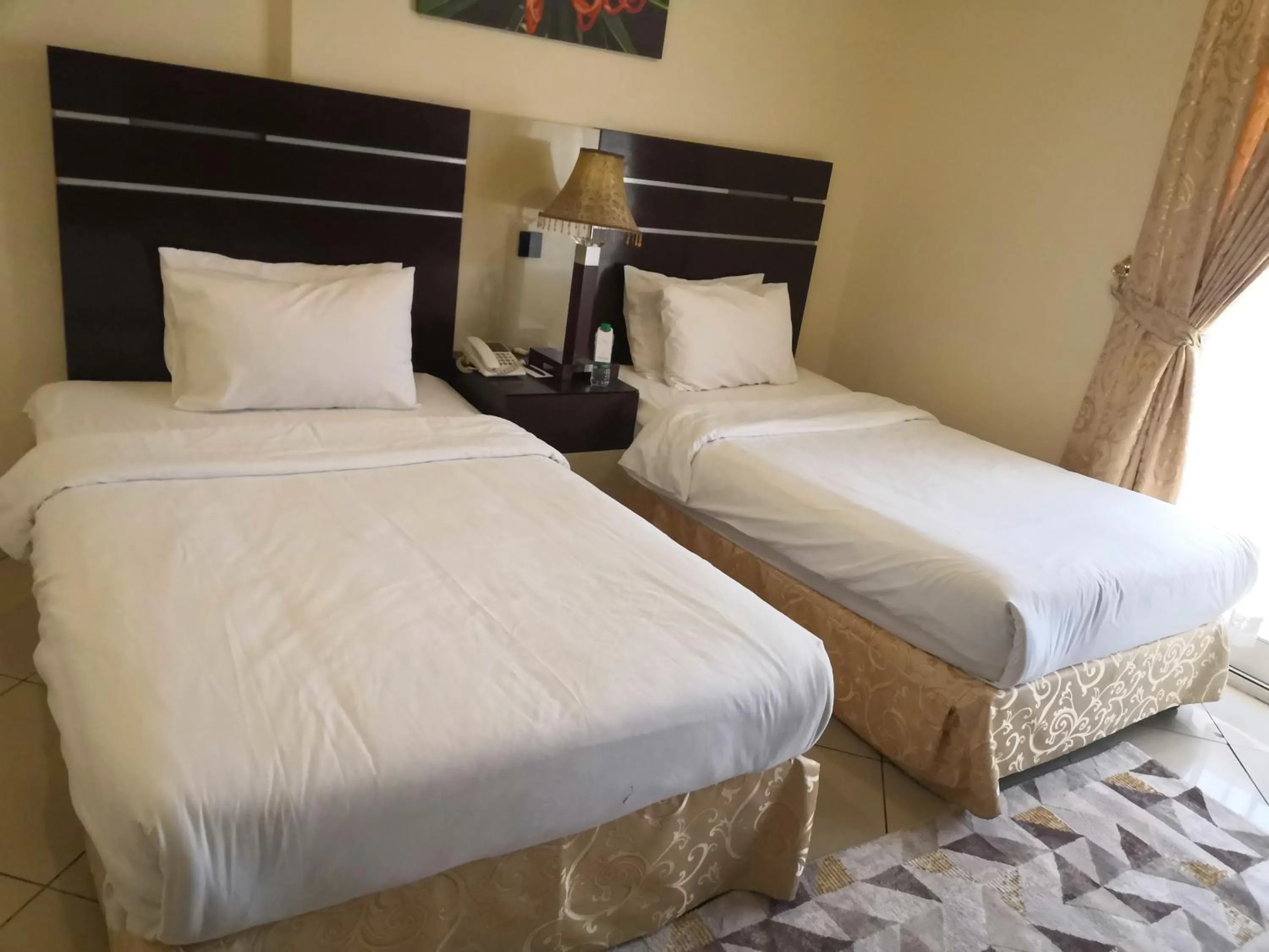 Bed in Boulevard City Suites Hotel Apartments
