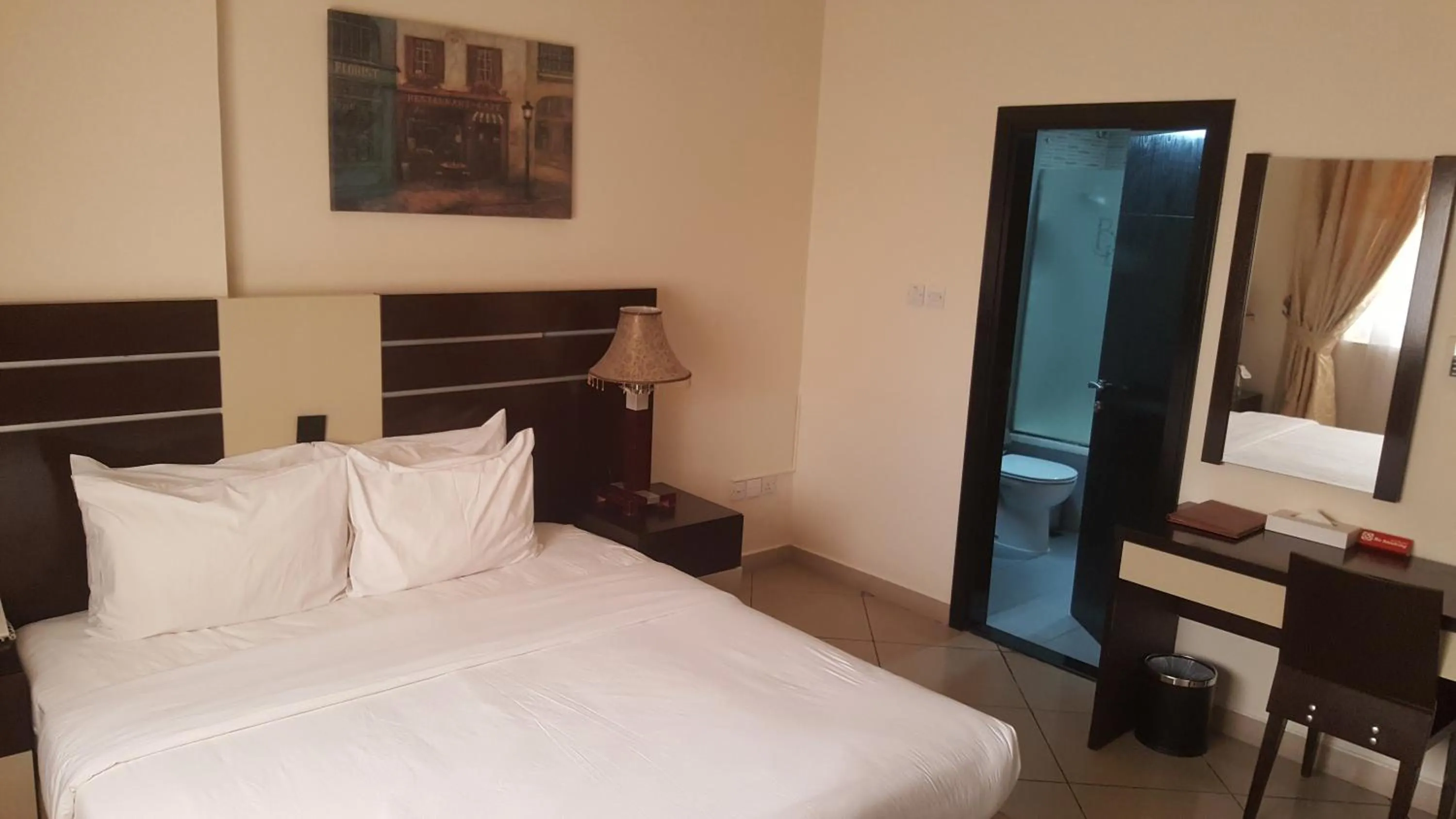 Bed in Boulevard City Suites Hotel Apartments