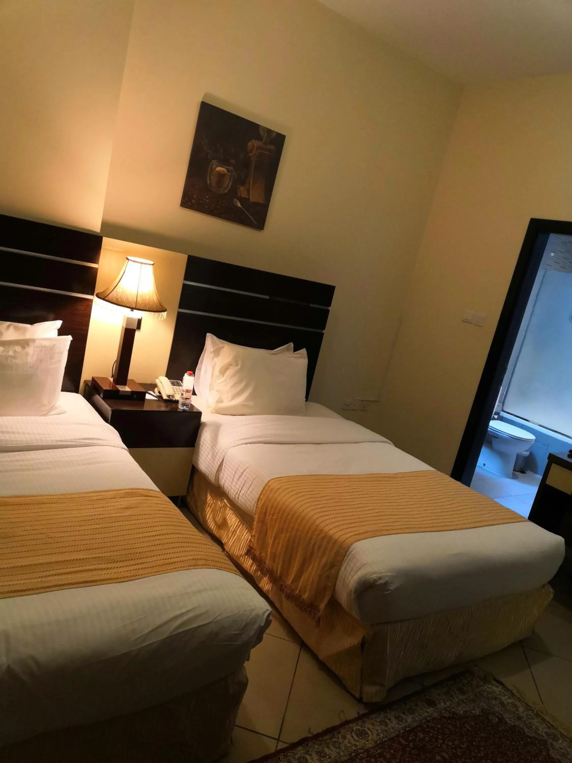 Bed in Boulevard City Suites Hotel Apartments