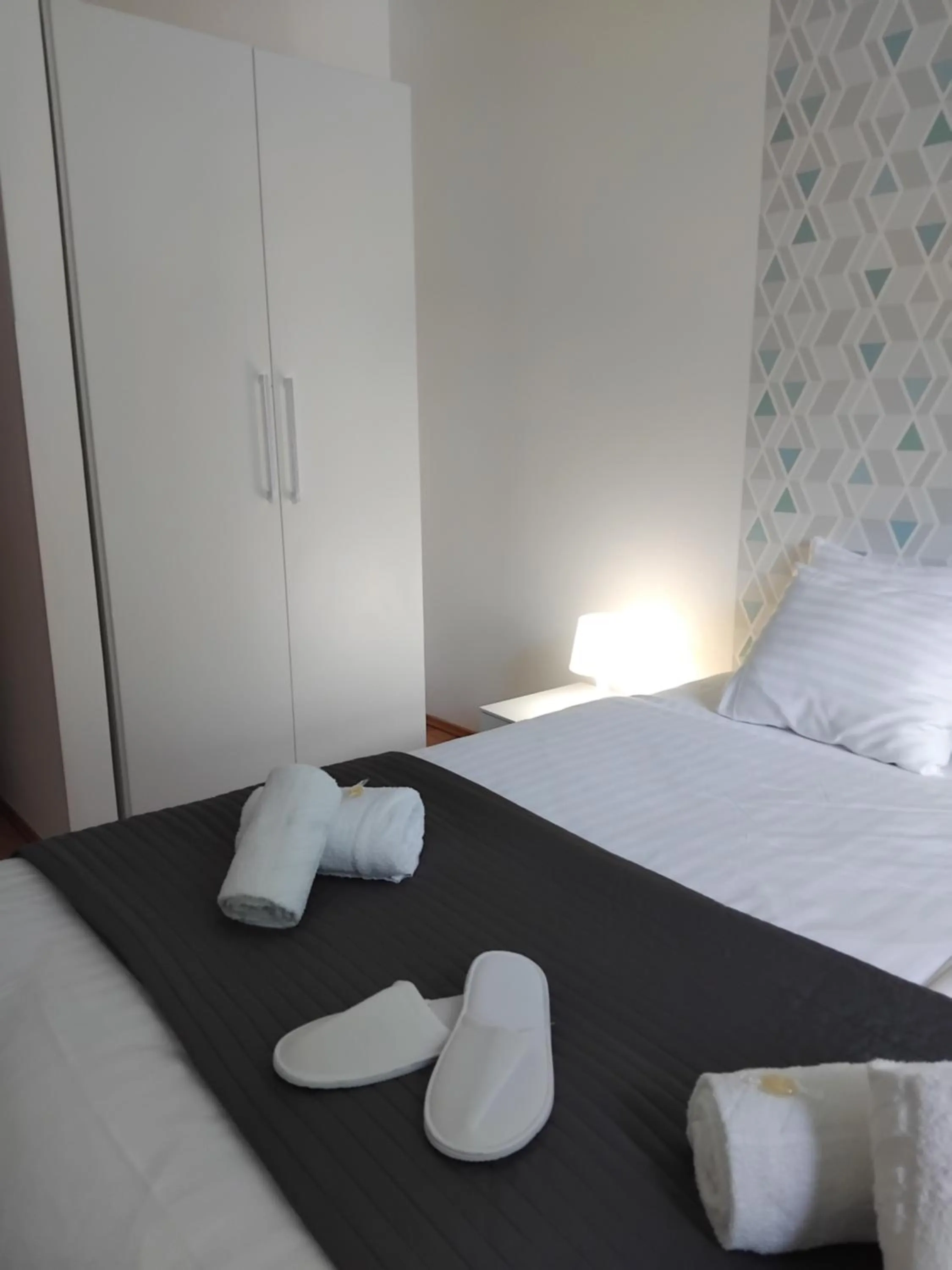 Bed in Corvin Center Suites