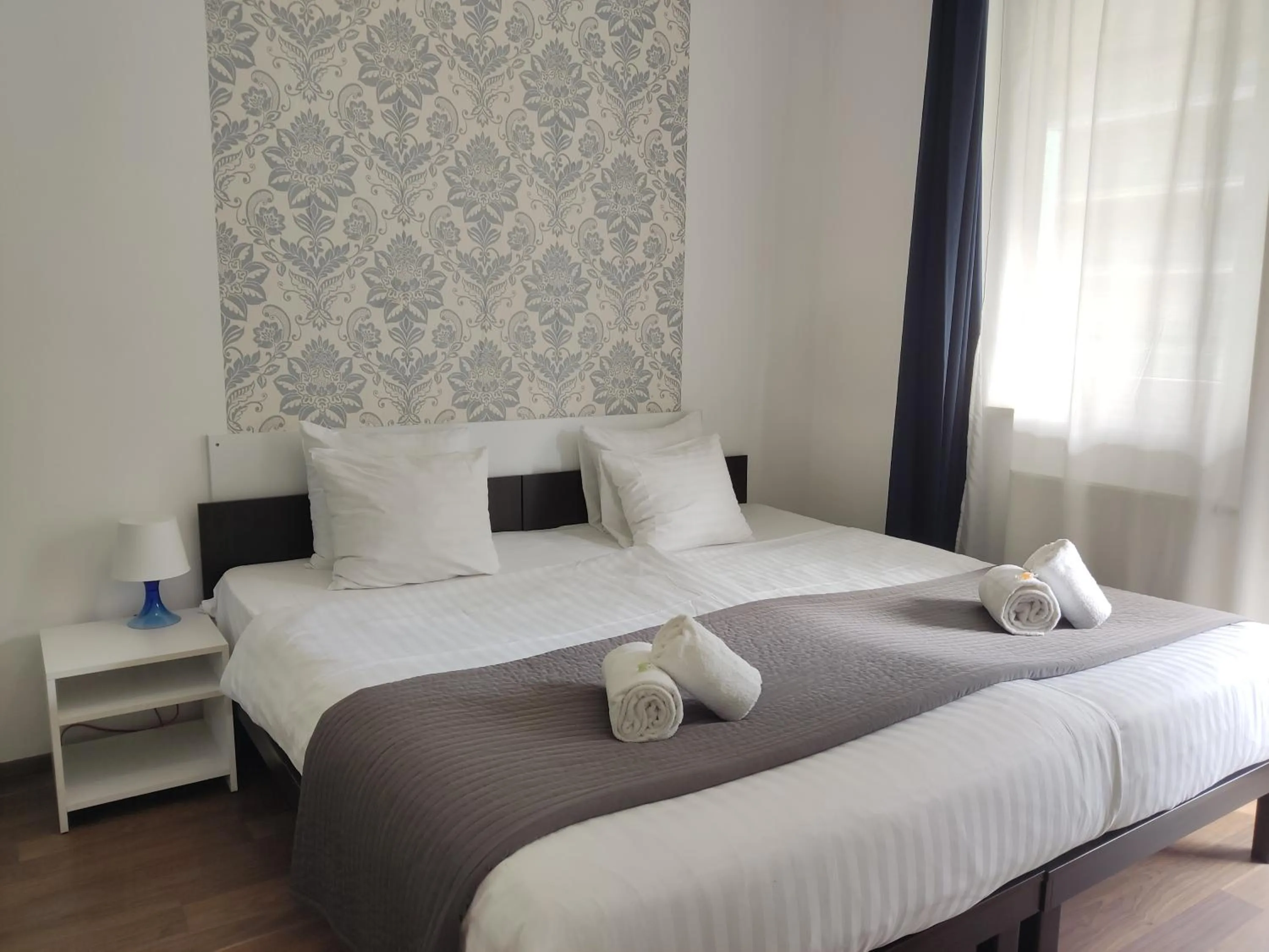 Bed in Corvin Center Suites