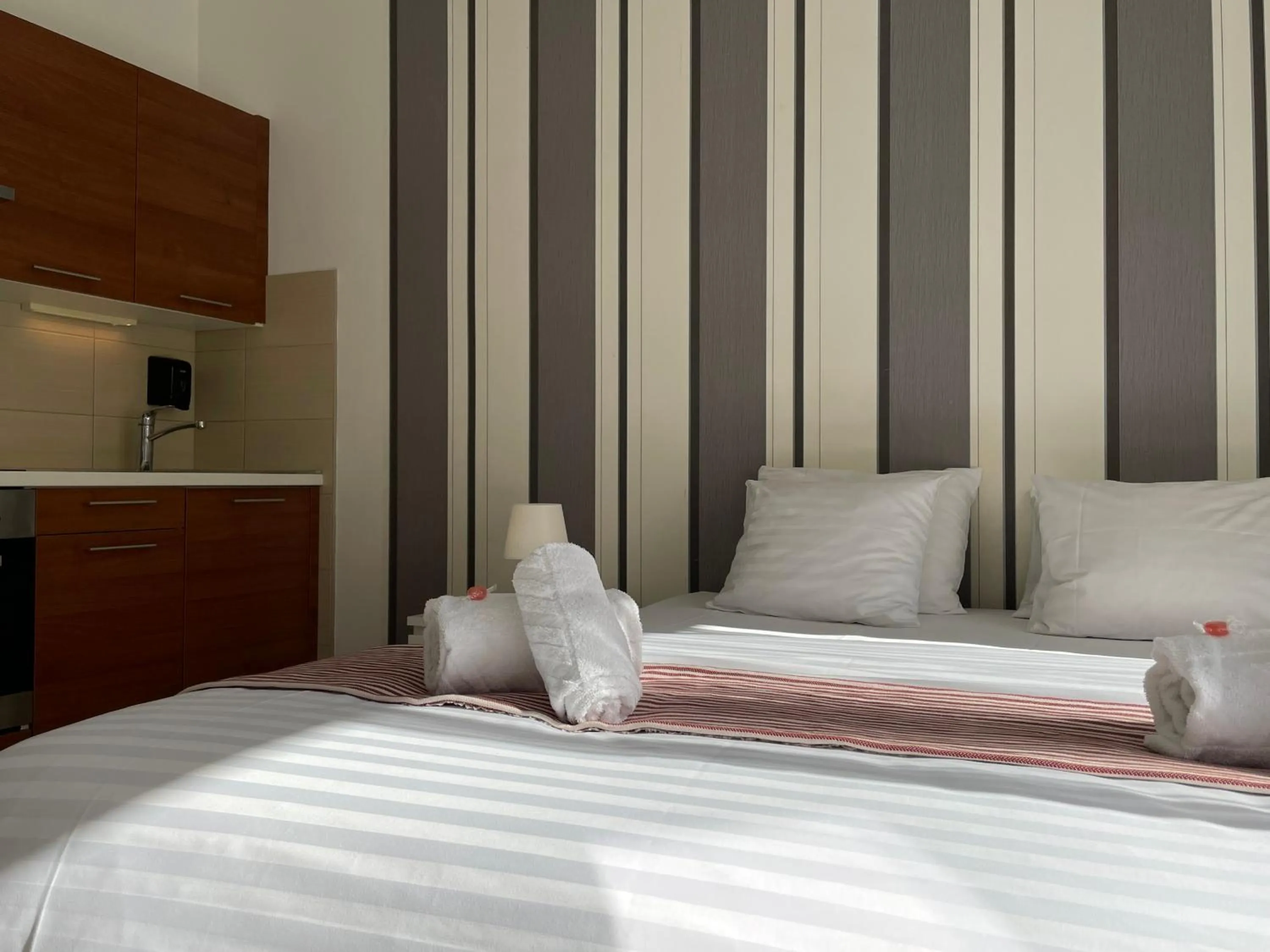 Bed in Corvin Center Suites