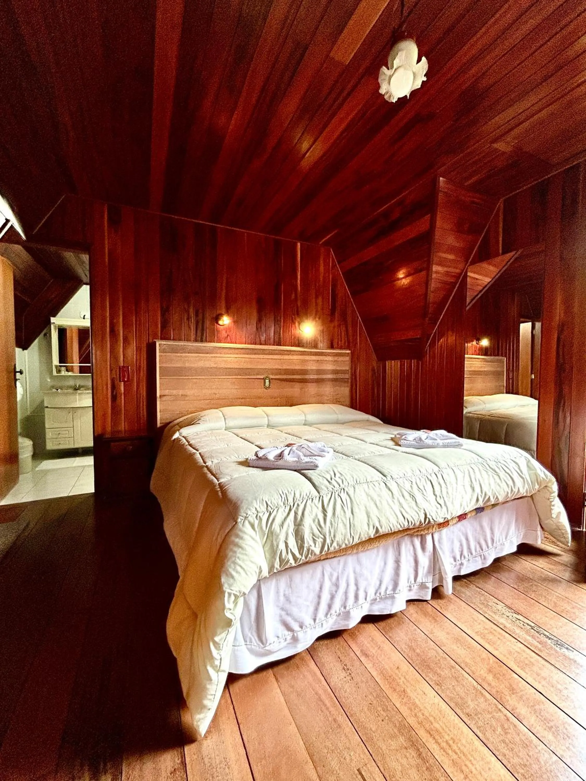 Bed in Pousada dos Esquilos