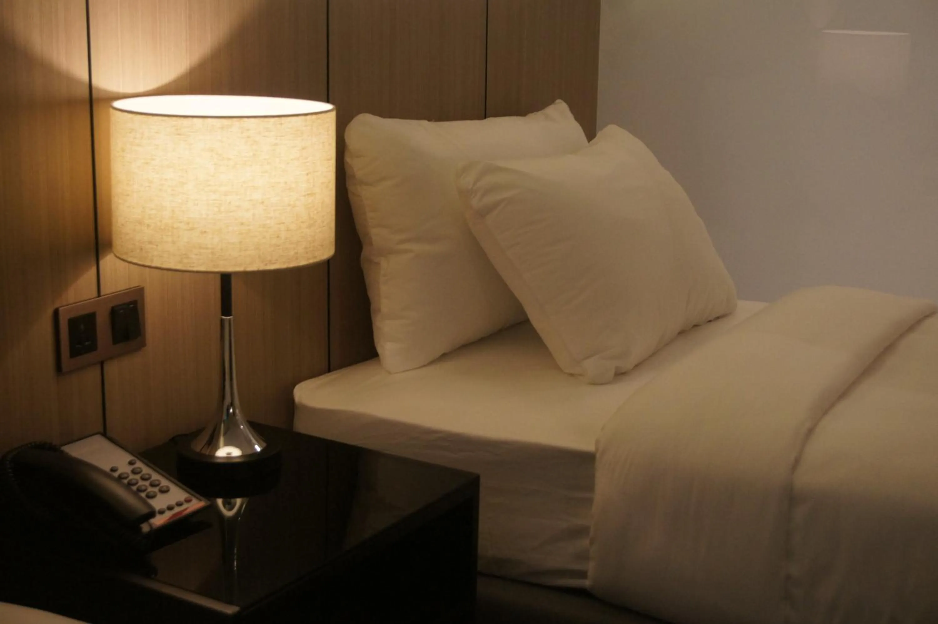 Bed in The Maximilian Hotel