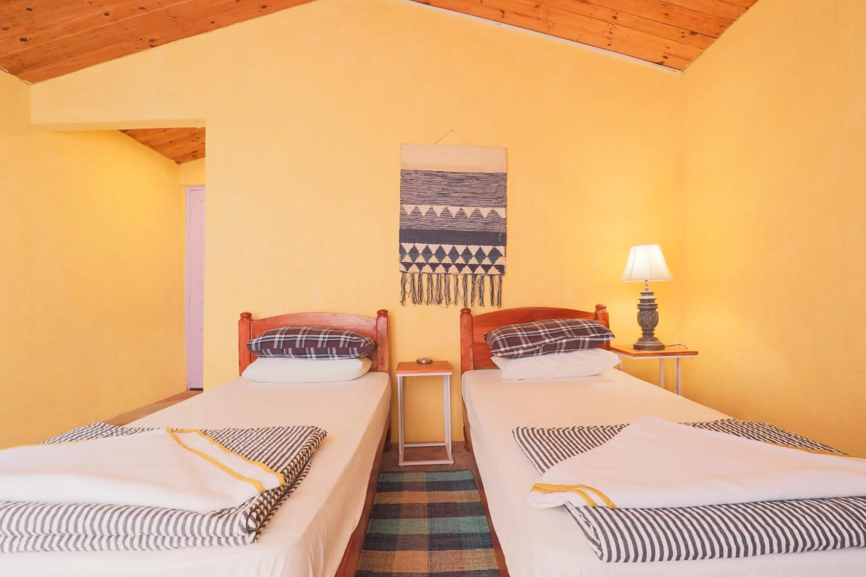 Bed in MANJARI RESORT