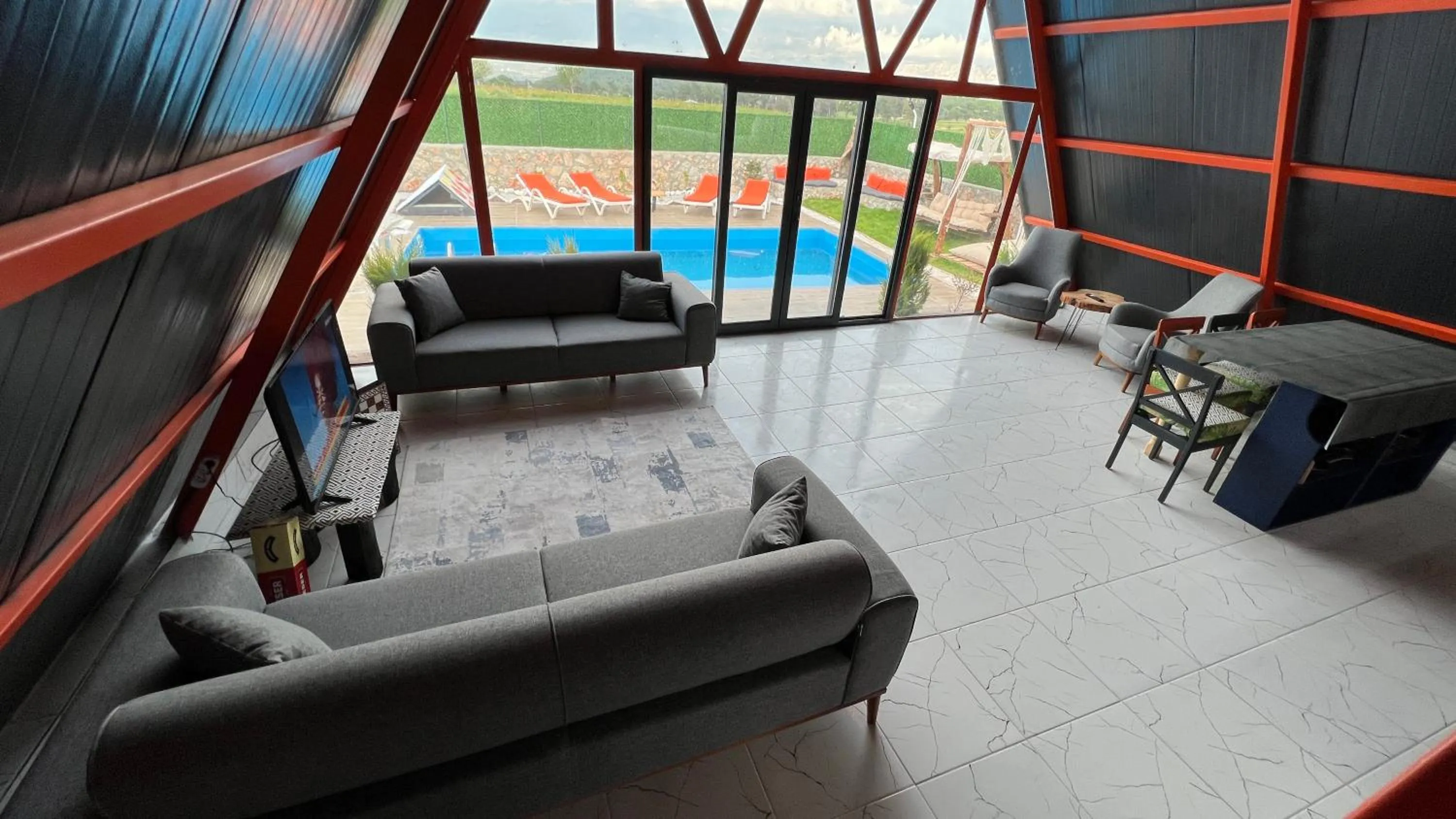 Communal lounge/ TV room in villa hidden paradise garden