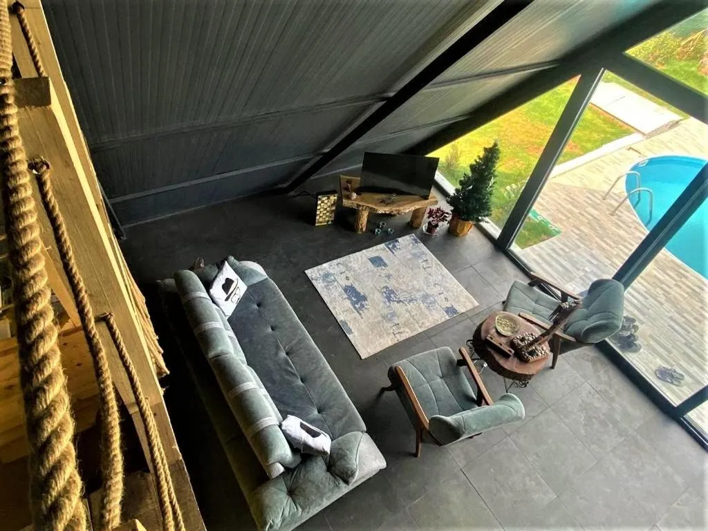 Communal lounge/ TV room in villa hidden paradise garden