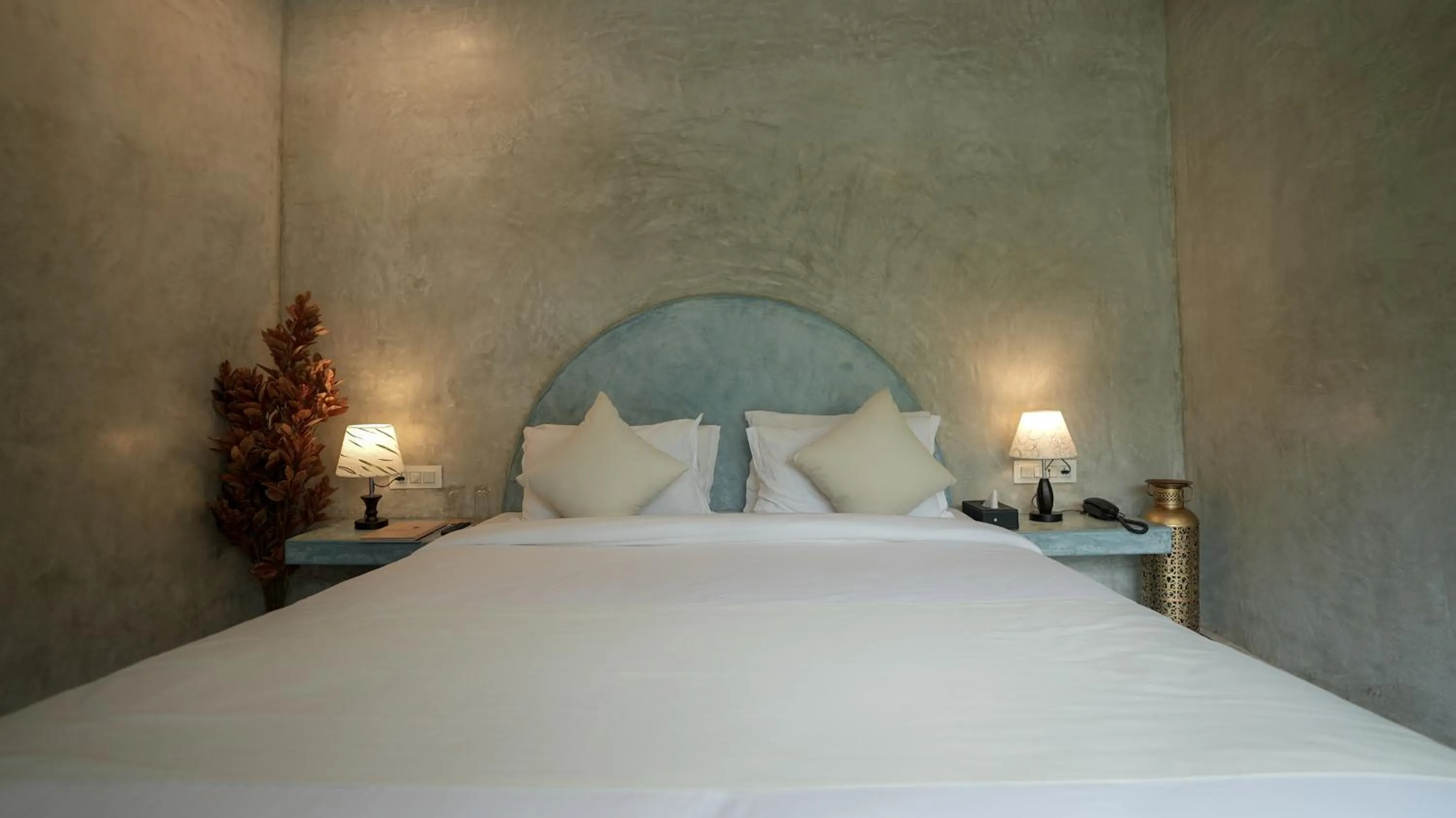 Bed in Whiteflower Resort Morjim