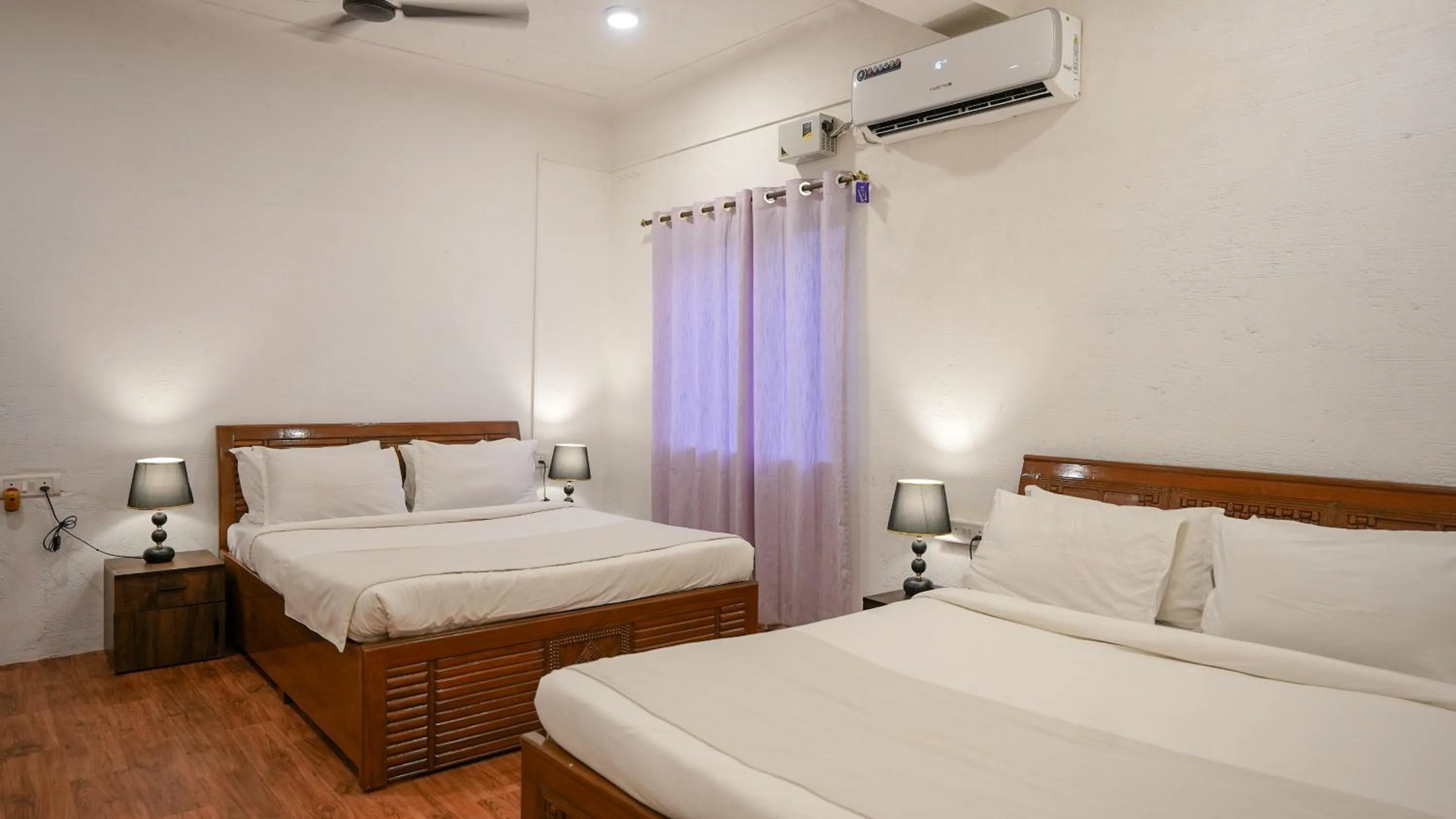 Bed in Whiteflower Resort Morjim