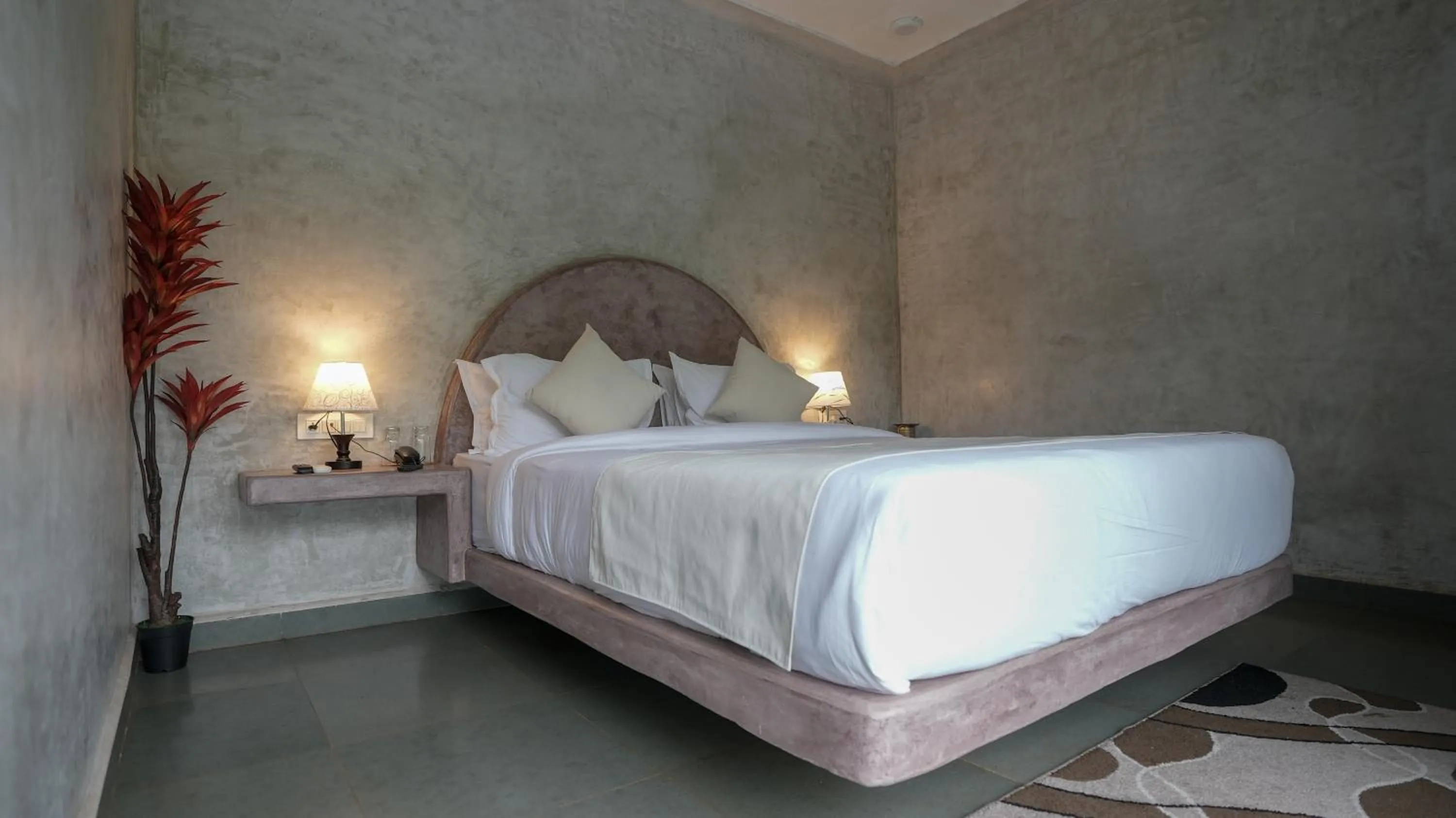 Bed in Whiteflower Resort Morjim