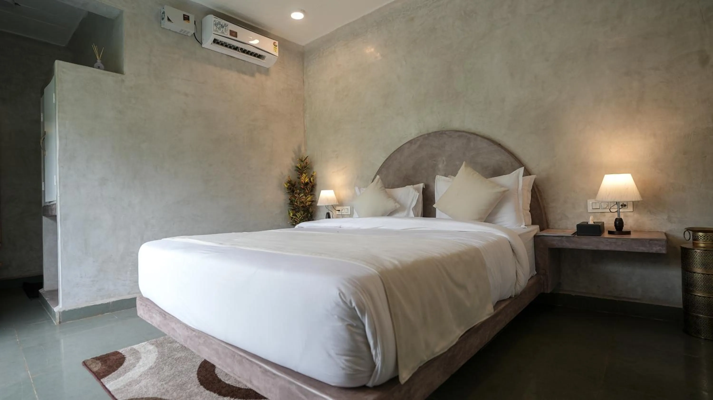 Bed in Whiteflower Resort Morjim