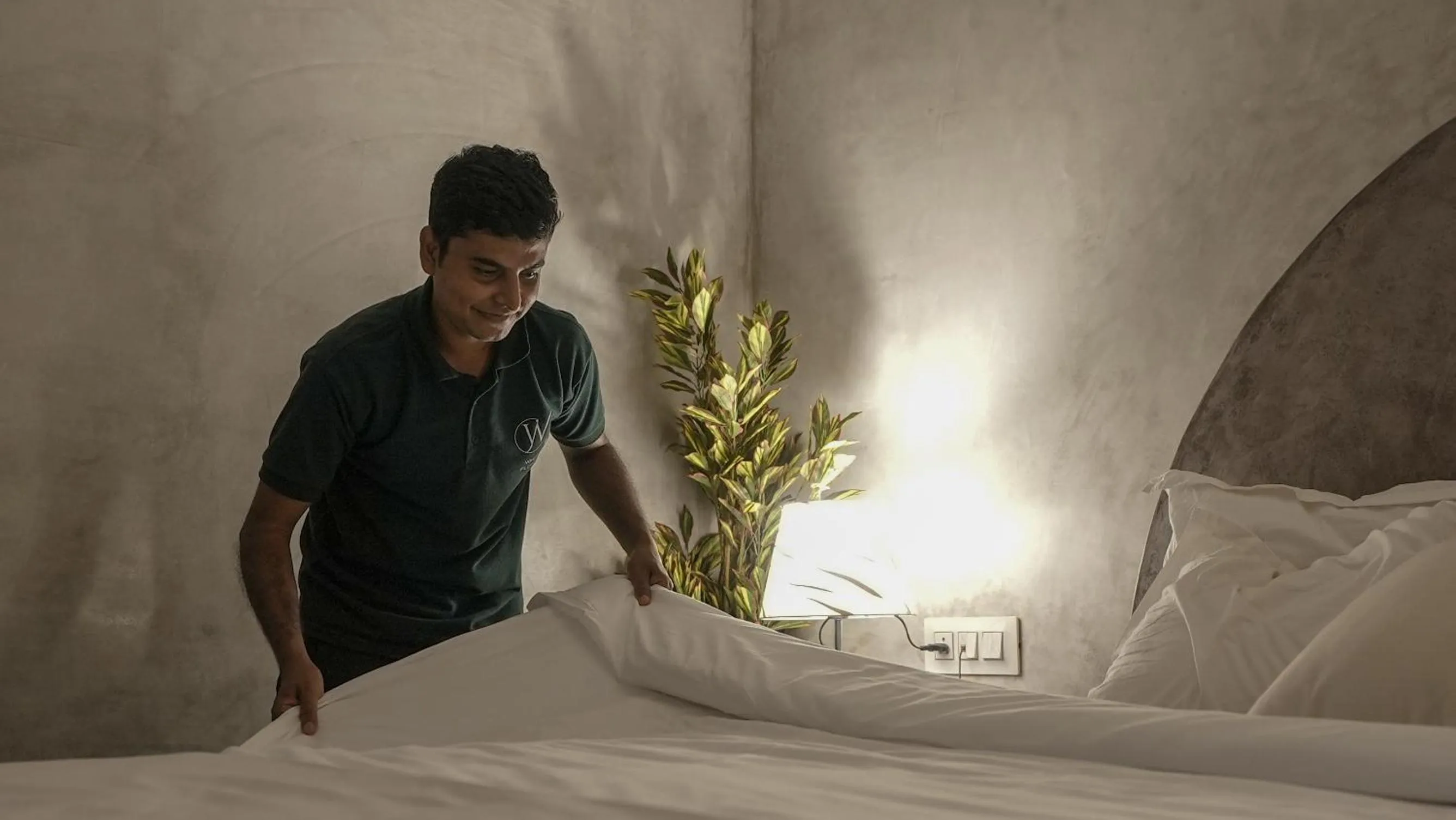 Bed in Whiteflower Resort Morjim