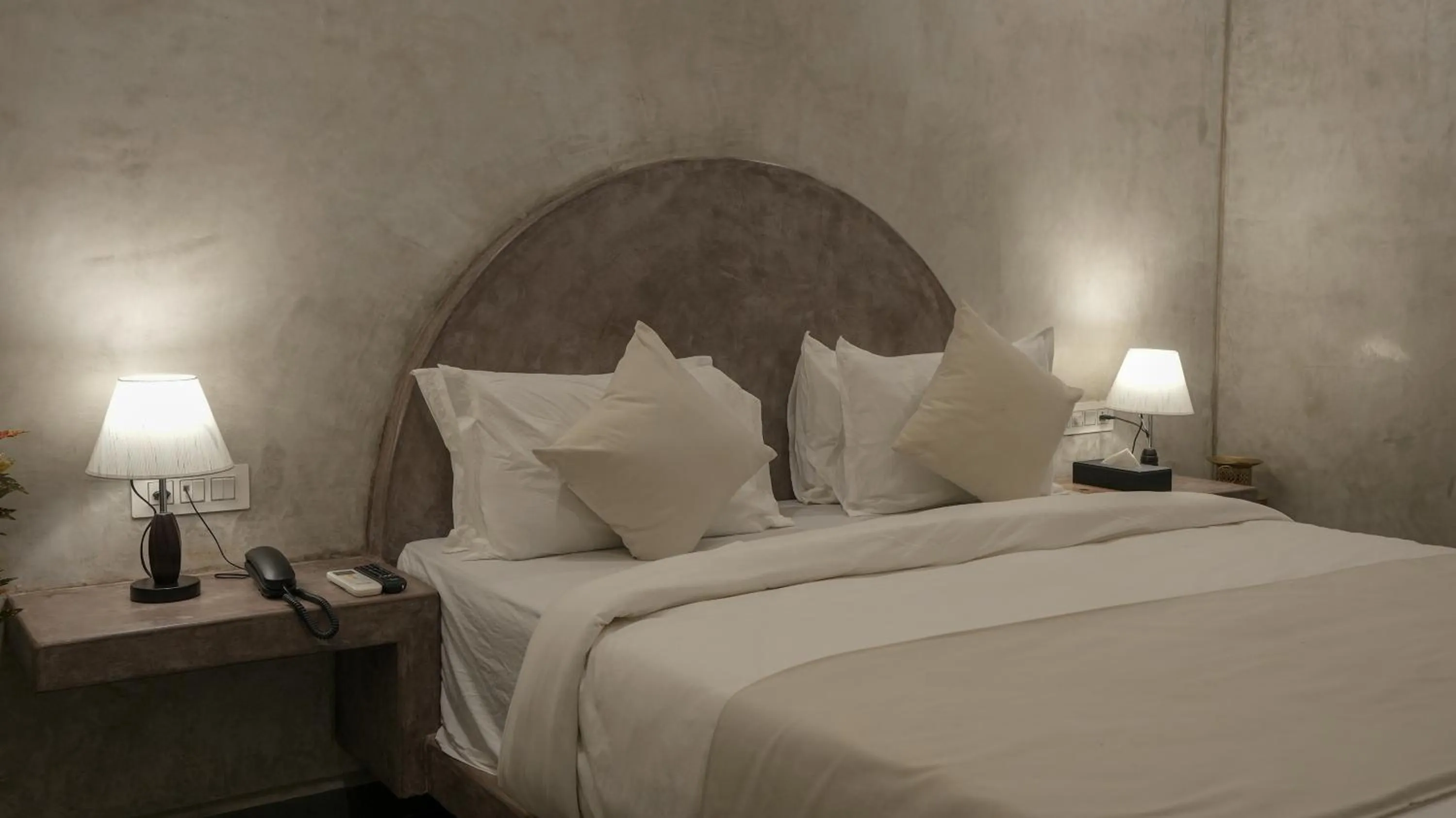 Bed in Whiteflower Resort Morjim