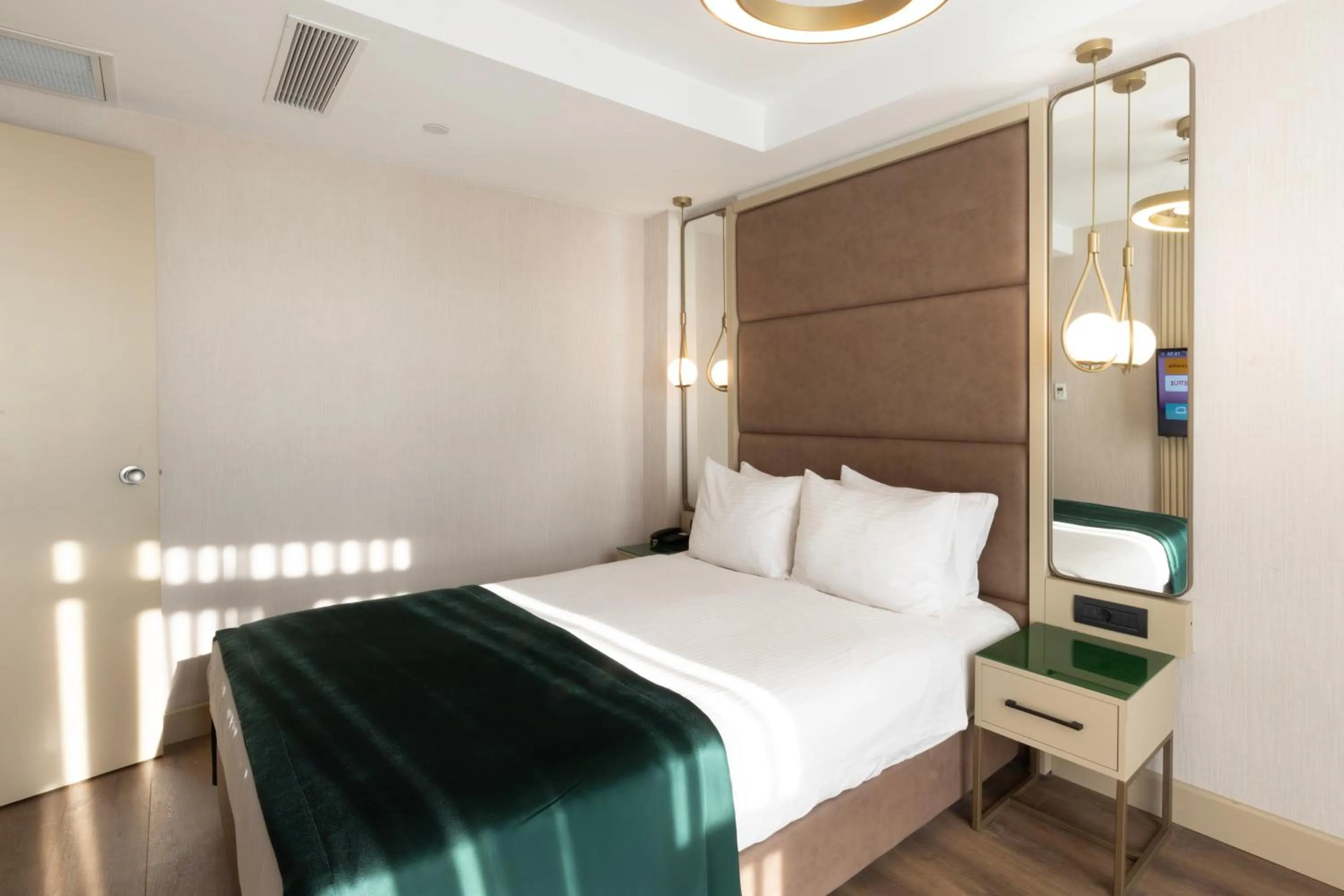 Bed in THE NEST HOTEL