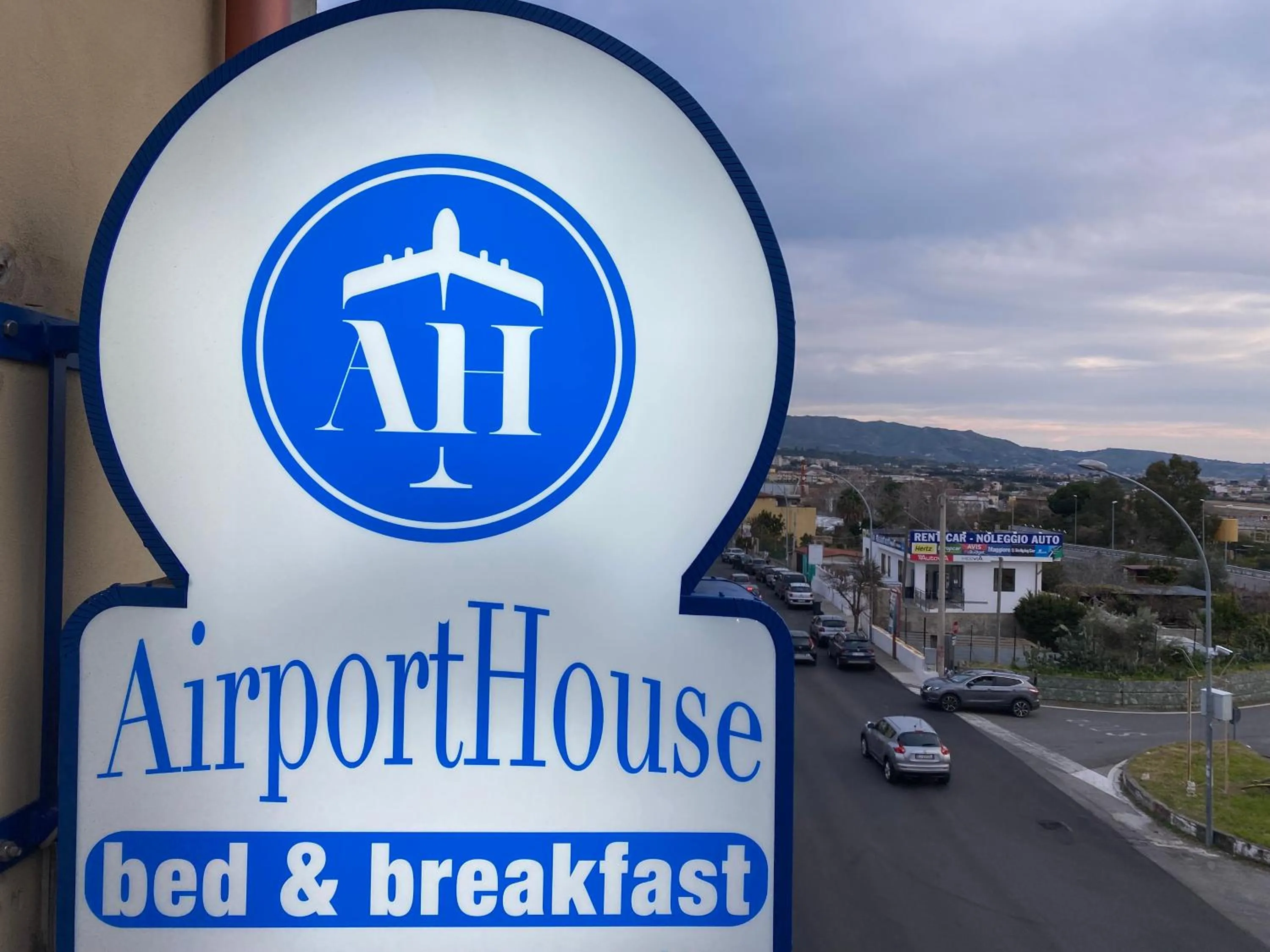 Property logo or sign in Airport House B&B