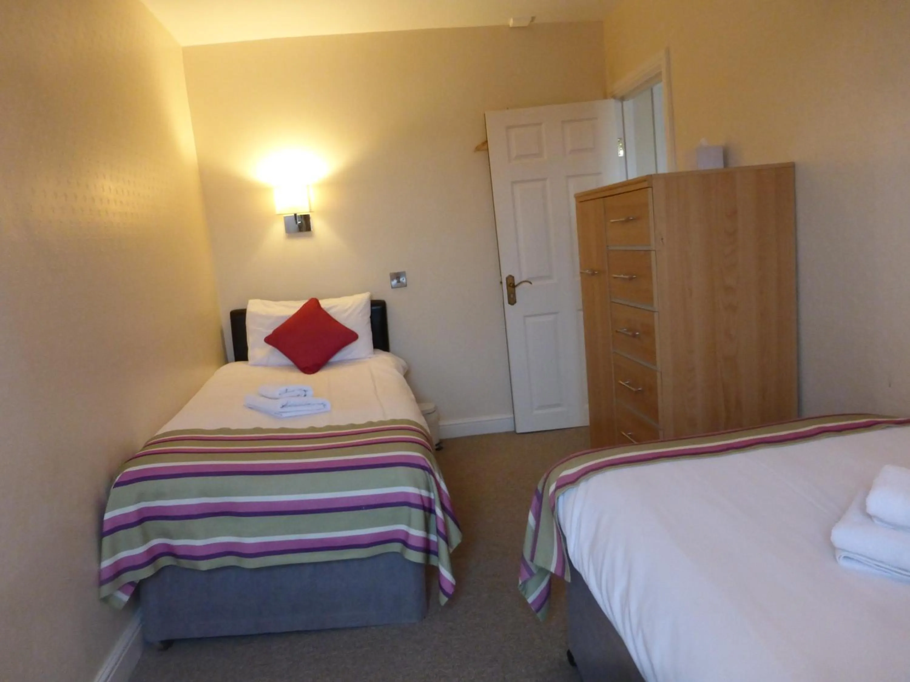 Bed in Harry's Hotel & Restaurant