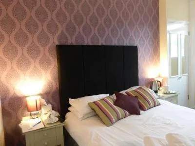 Bed in Harry's Hotel & Restaurant