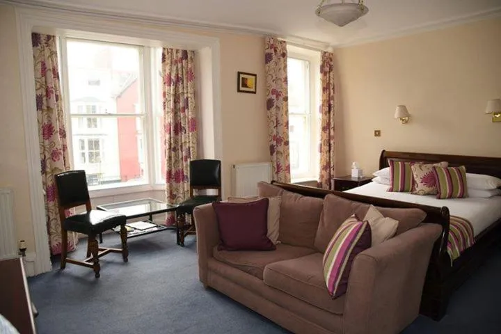 Bed in Harry's Hotel & Restaurant