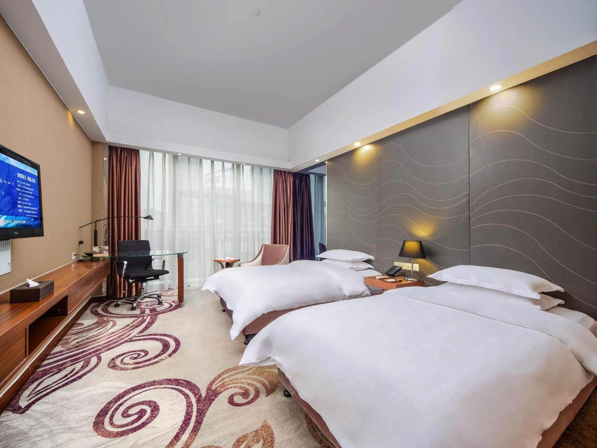 Bed in Metropolo Hotel Zhenjia Wanda Plaza Railway Station