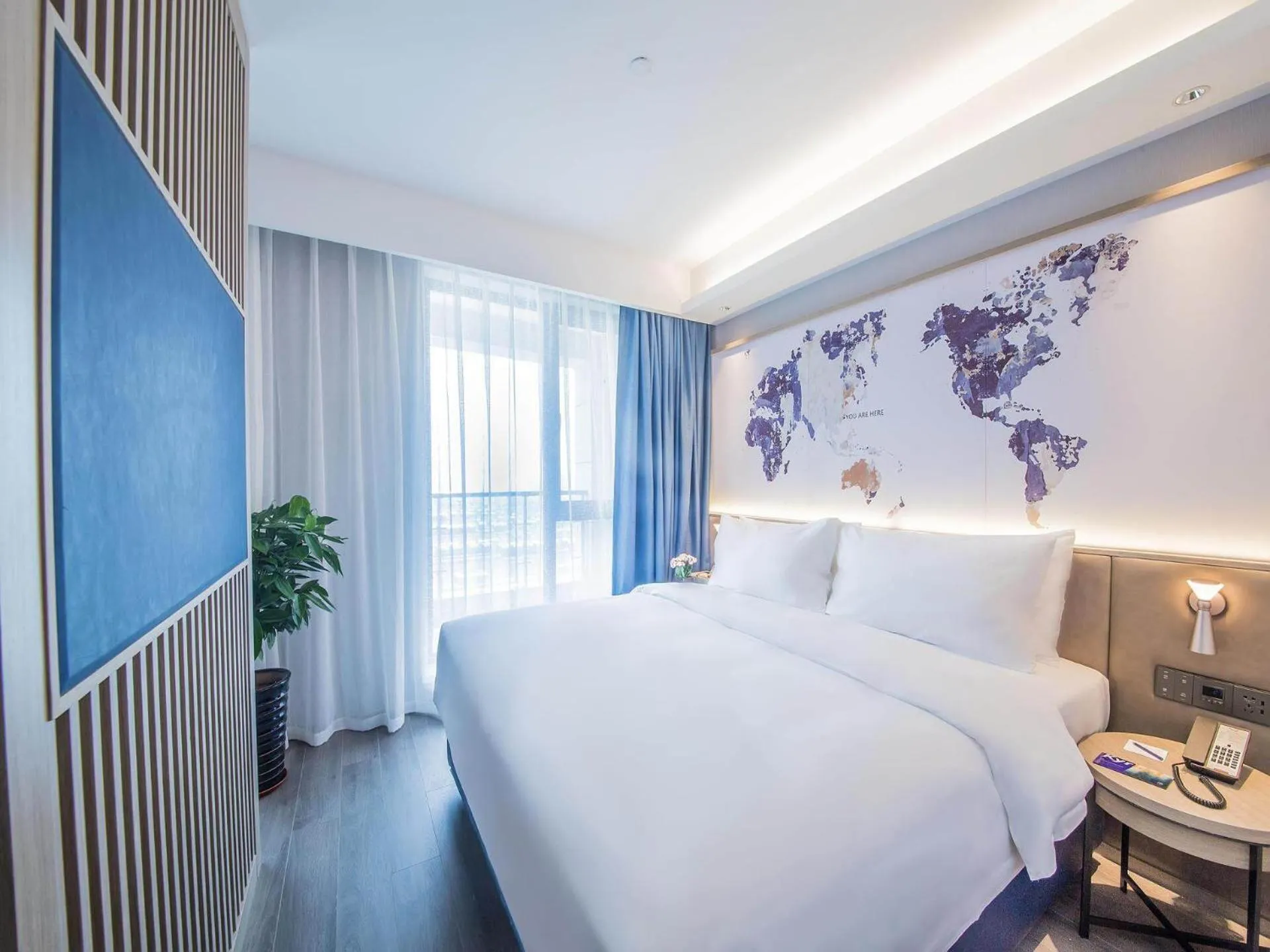 Bed in Kyriad Marvelous Hotel Qinhuangdao Nandaihe