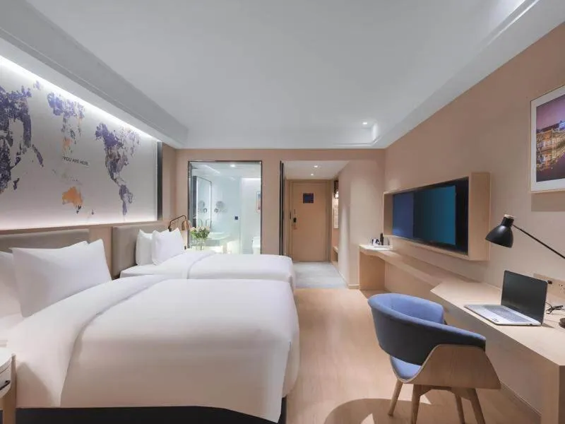 Bed in Kyriad Marvelous Hotel Suzhou Wujiang People Square