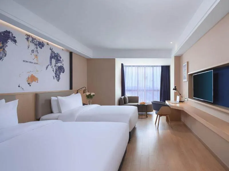 Bed in Kyriad Marvelous Hotel Suzhou Wujiang People Square