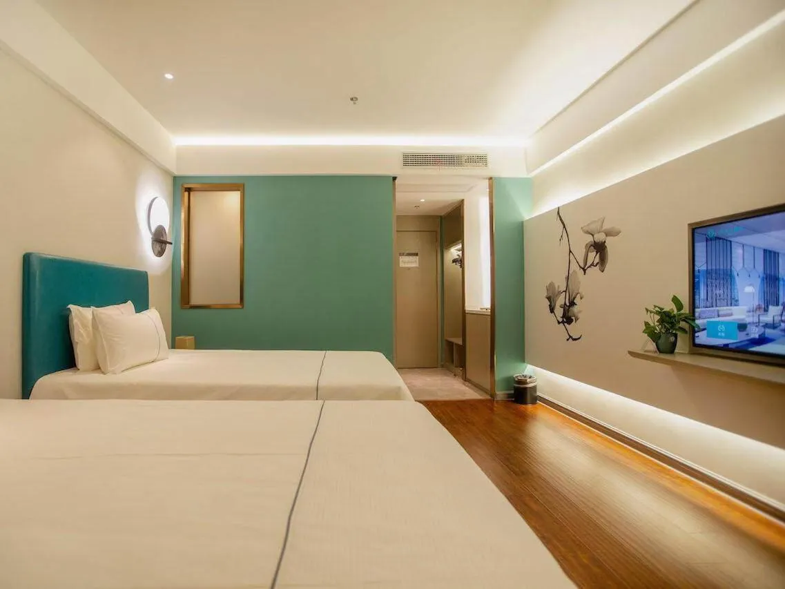 Bed in Magnotel Hotel Yangzhou Jinghua Wangyue Road