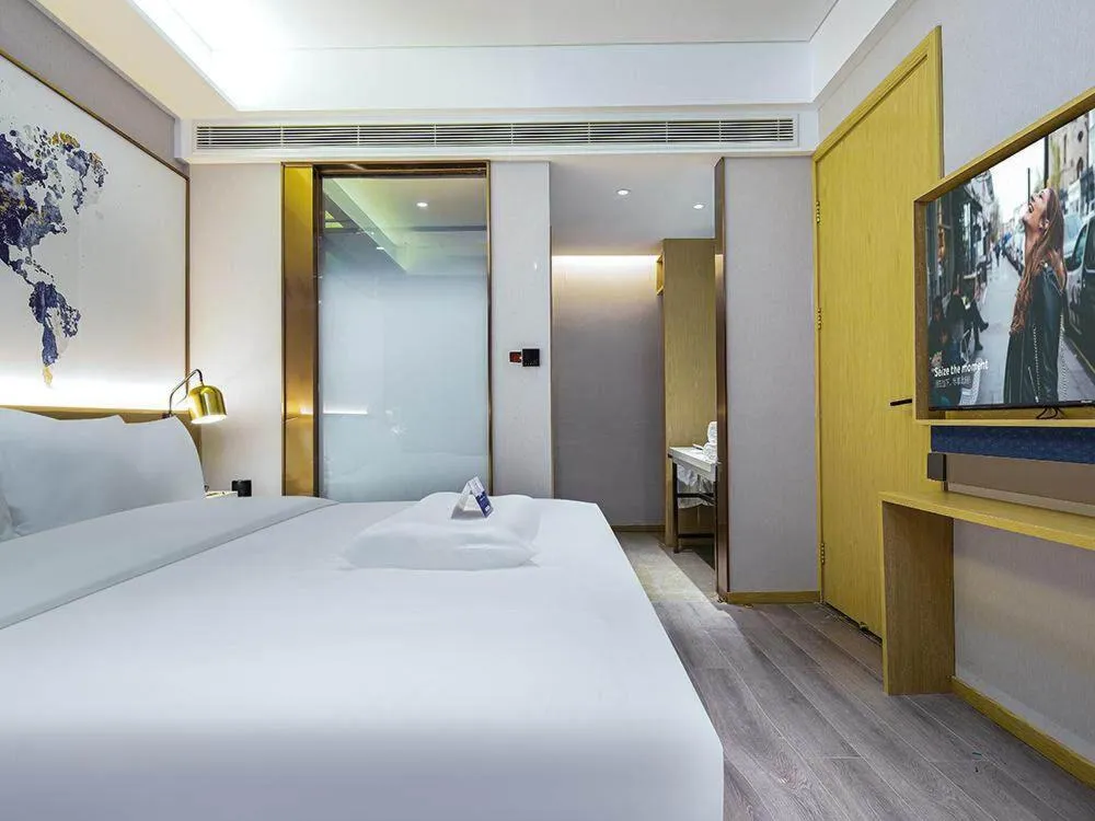 Bed in Kyriad Marvelous Hotel Weihai Happy Gate Weigao Plaza