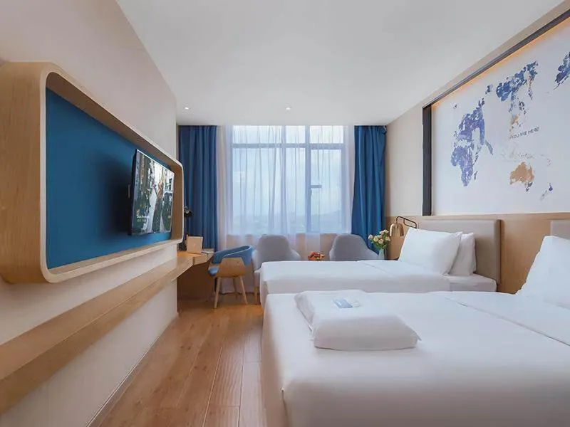 Bed in Kyriad Marvelous Hotel Huizhou Boluo Longxi