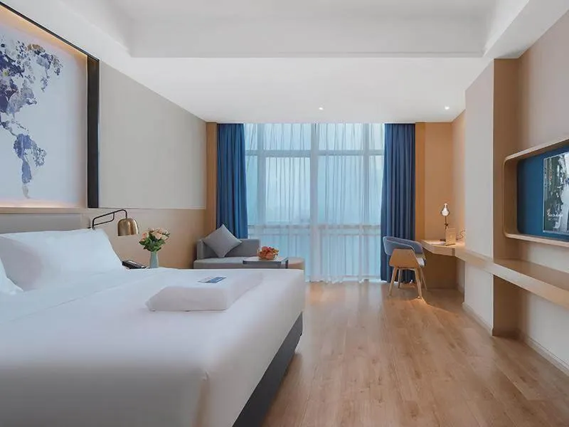Bed in Kyriad Marvelous Hotel Huizhou Boluo Longxi